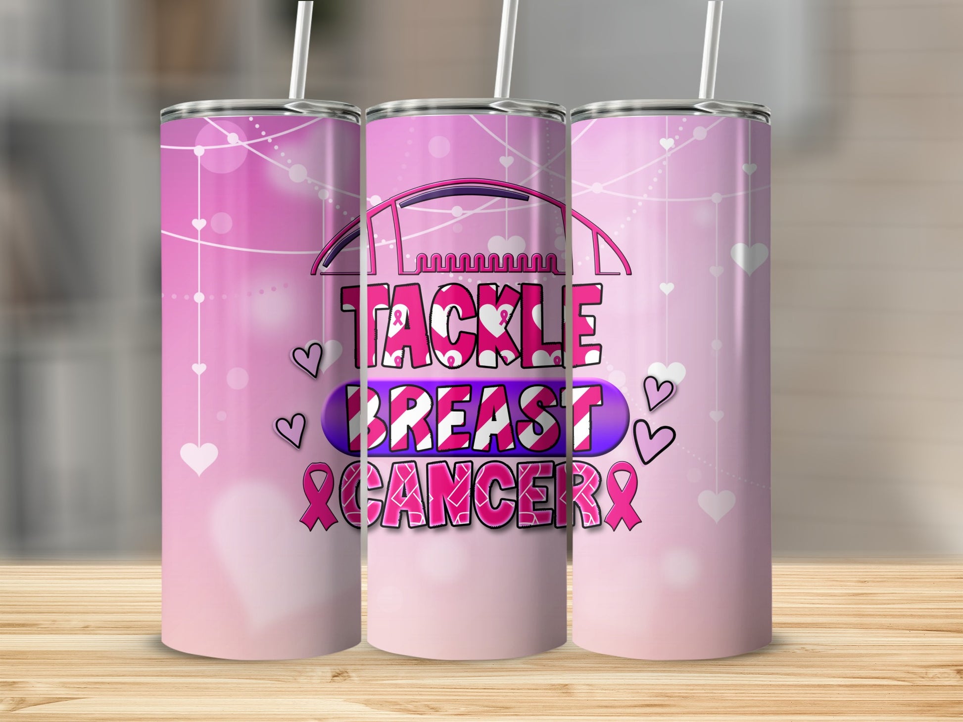 Pink tumbler with "Tackle Breast Cancer" text and hearts.