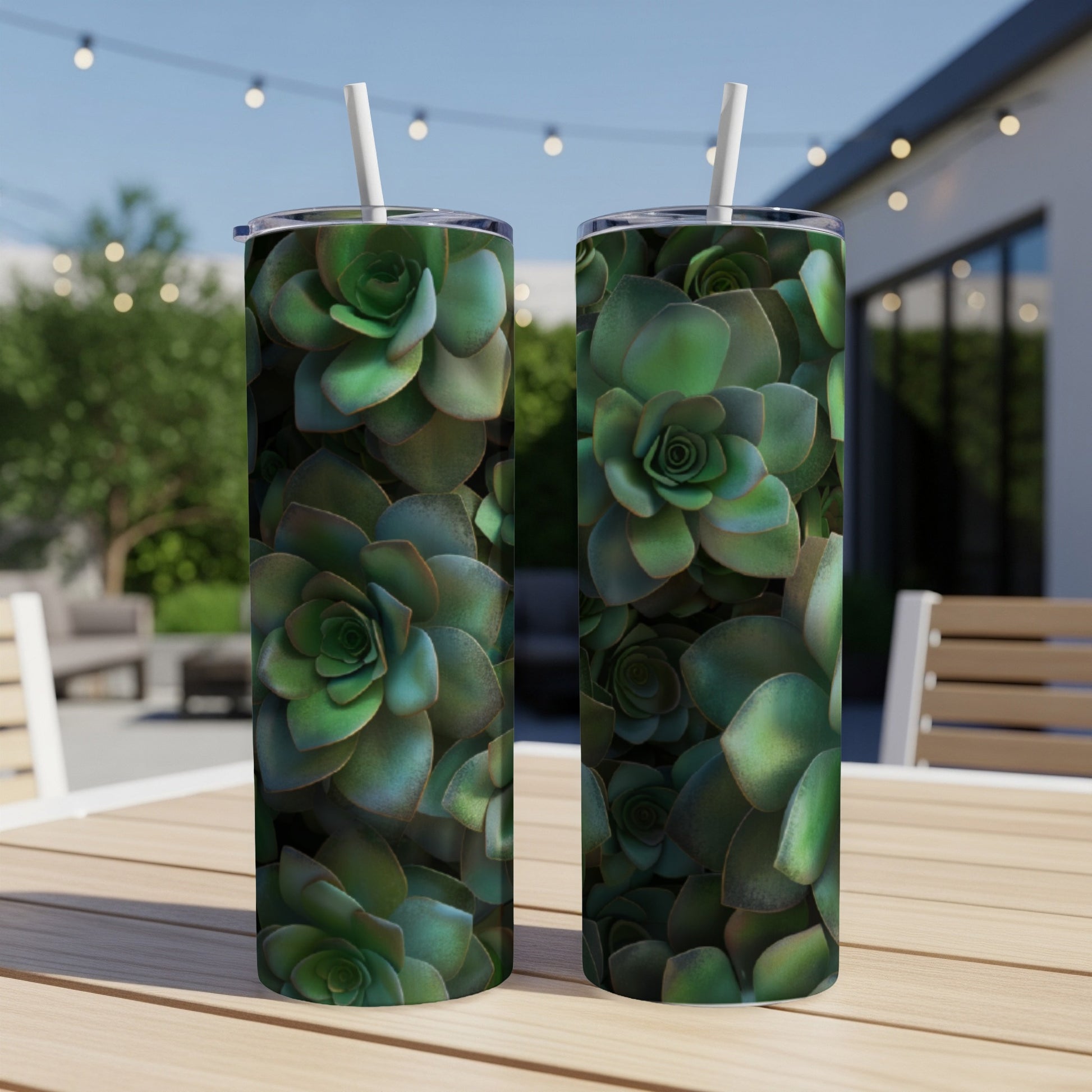 Two tumblers with a close-up succulent plant pattern on a wooden table.