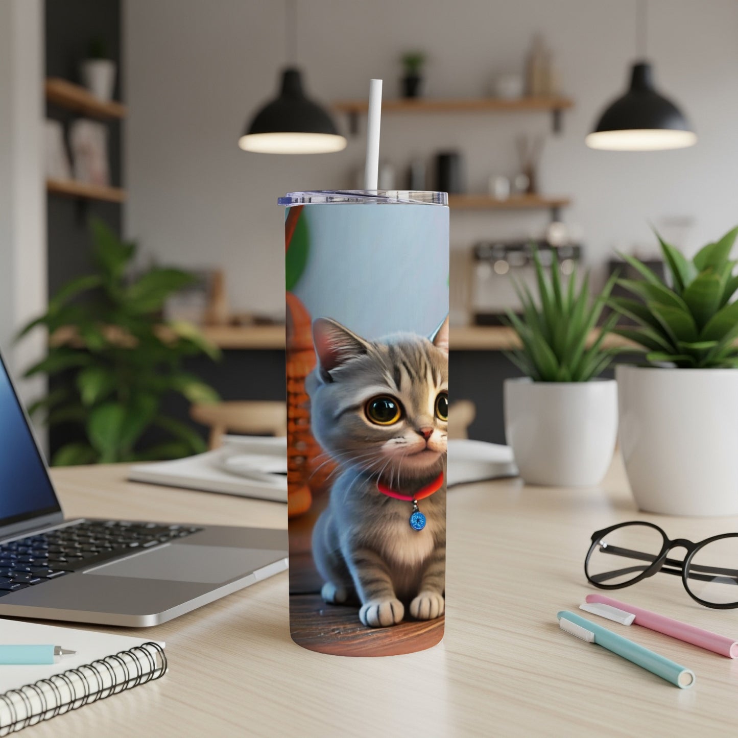 Cartoon cat with blue collar on a white tumbler, on a desk.