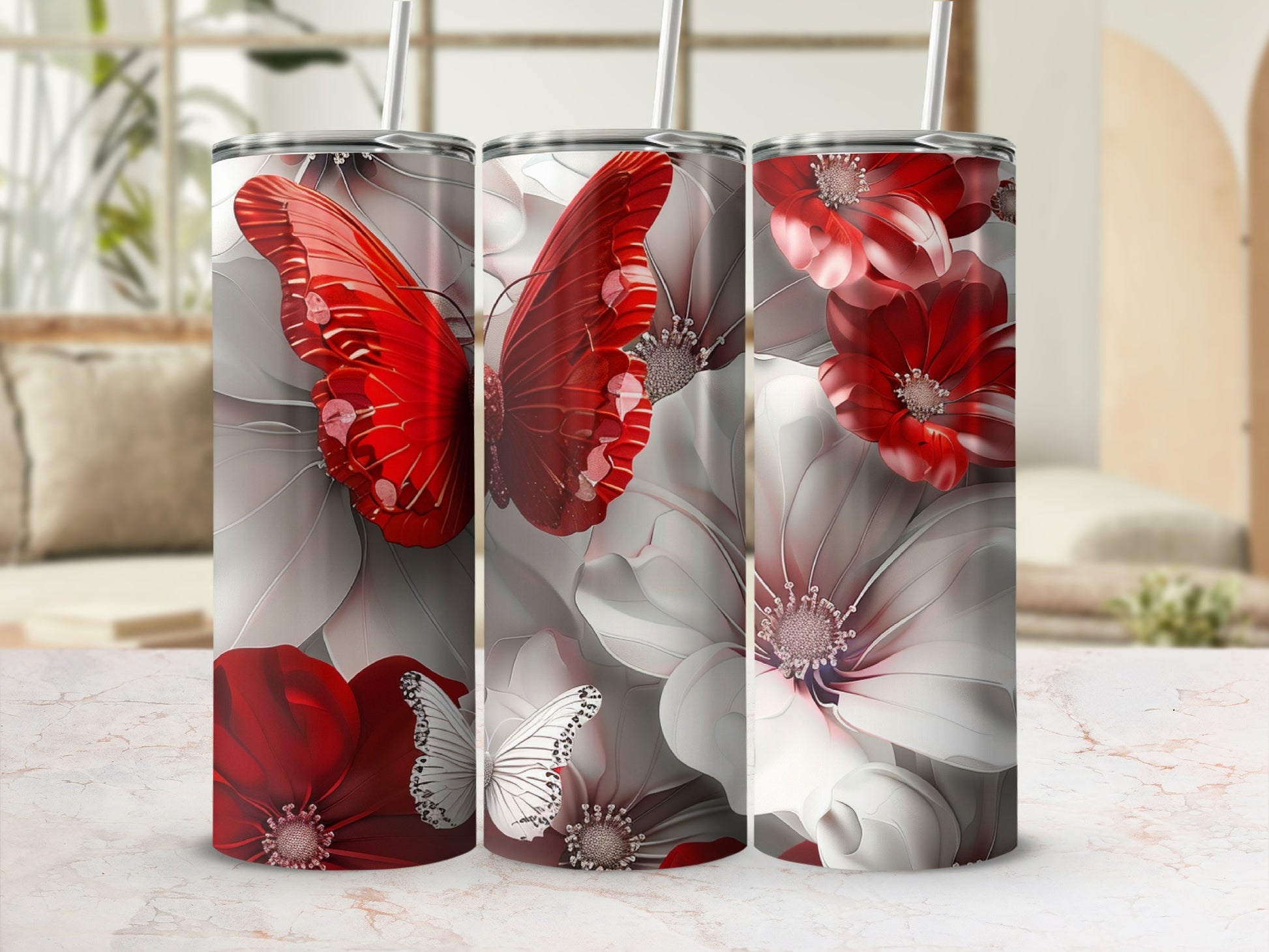 Three tumblers with red butterflies and white flowers design.