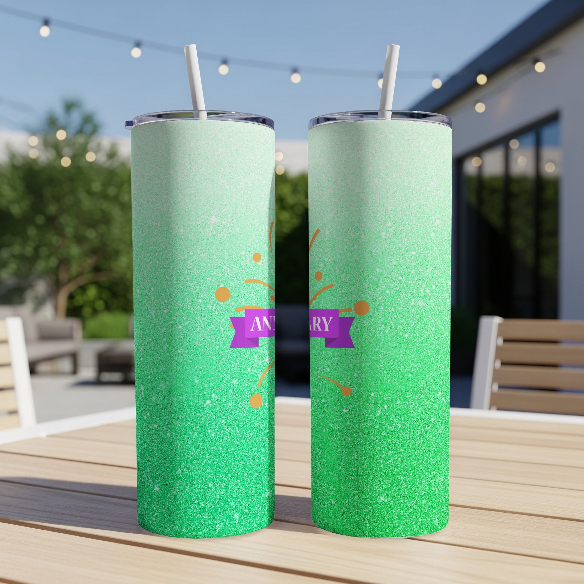 Two green glitter tumblers with "ANNIVERSARY" text on a purple banner.