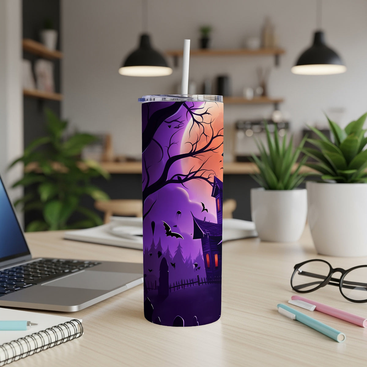 Tall tumbler with purple and orange Halloween scene featuring haunted house, bats, and cemetery.