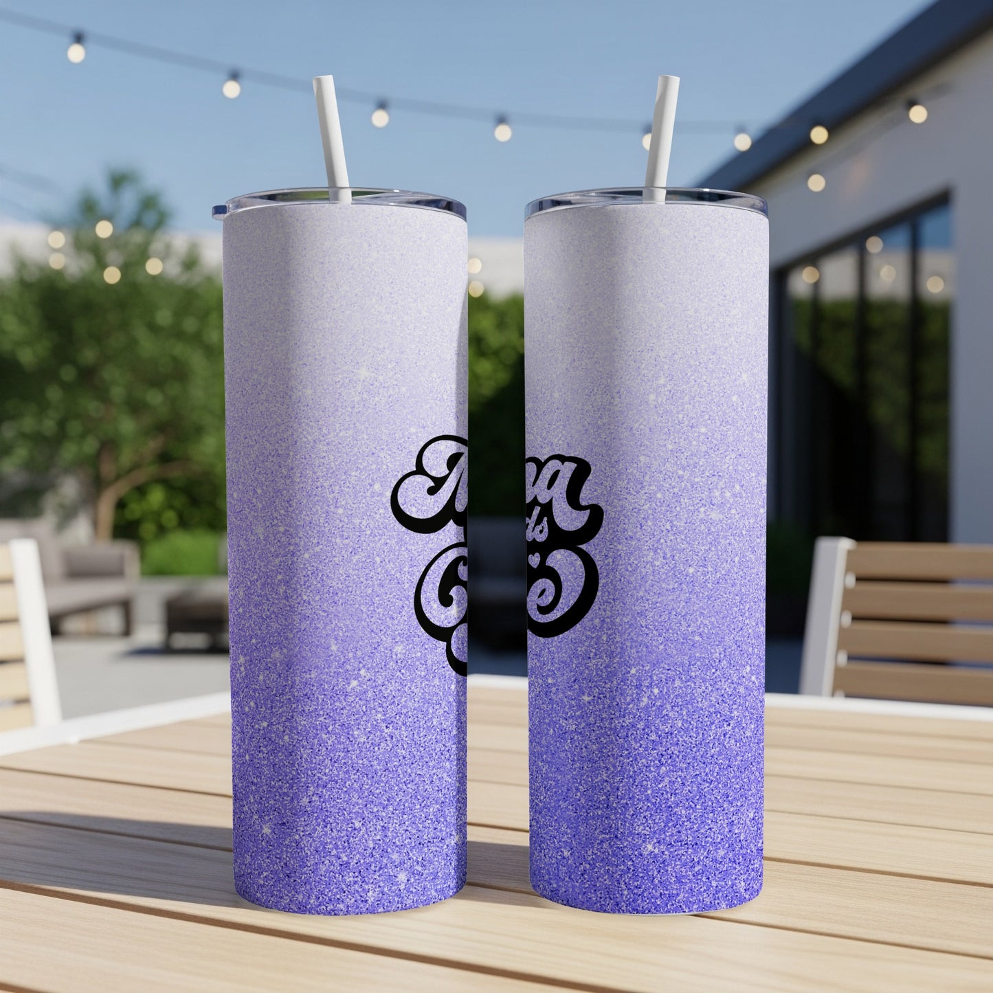 Glittery purple gradient tumbler with "Mama" text on an outdoor table.