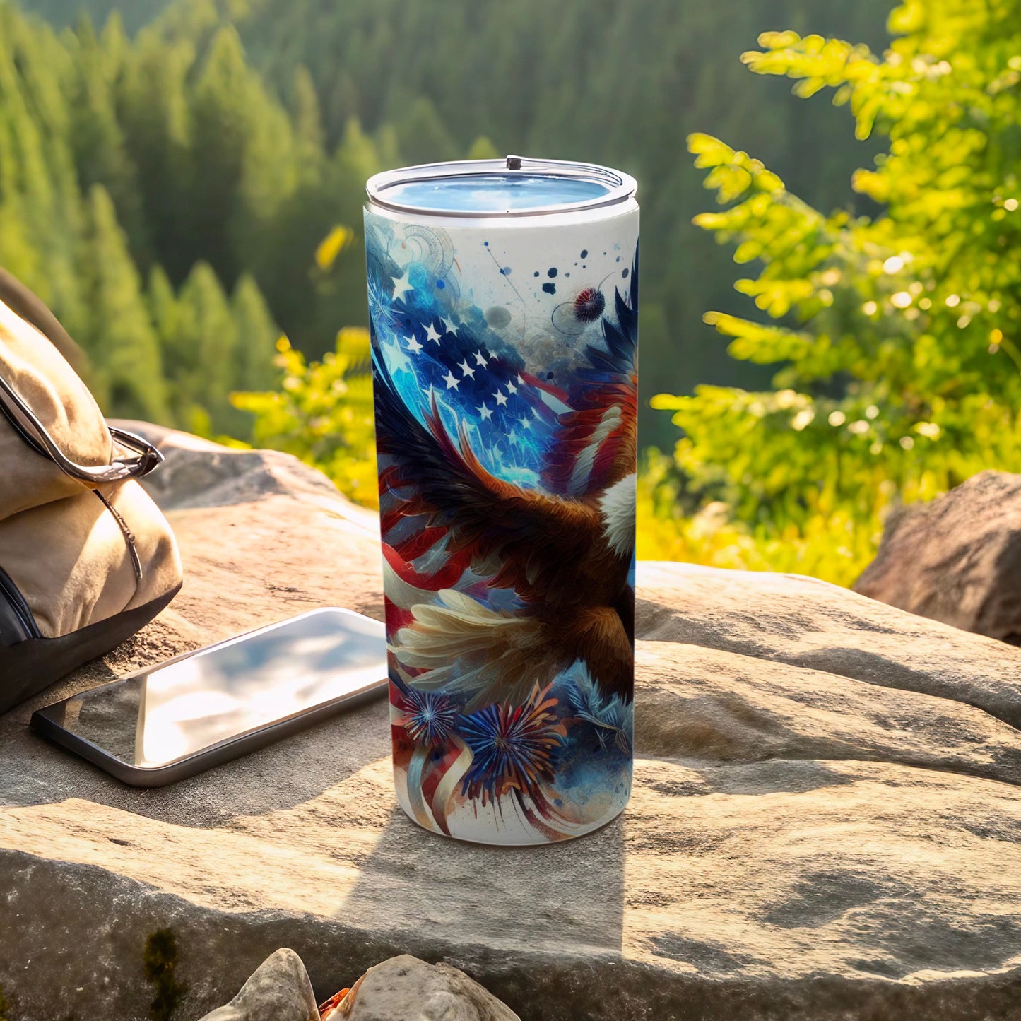 American flag eagle design on a white tumbler with a phone and backpack.