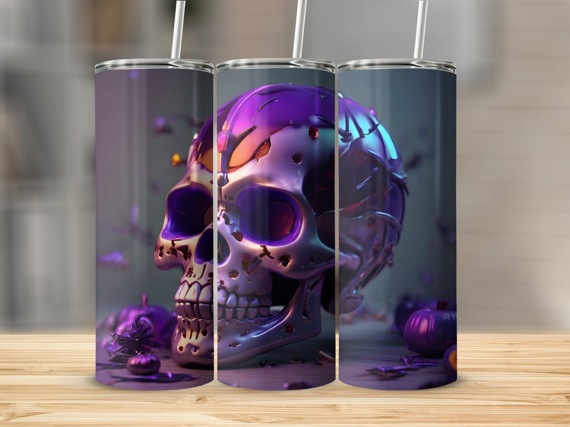 Three metallic skull tumblers with purple accents and straw on wooden surface.