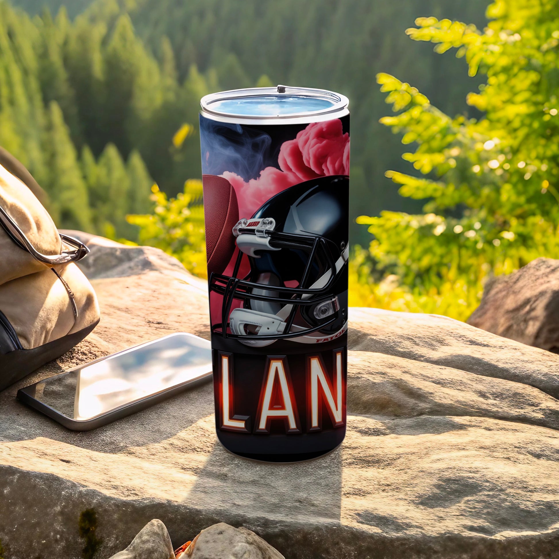 Black football helmet on a tumbler with "LAN" text, outdoor setting.