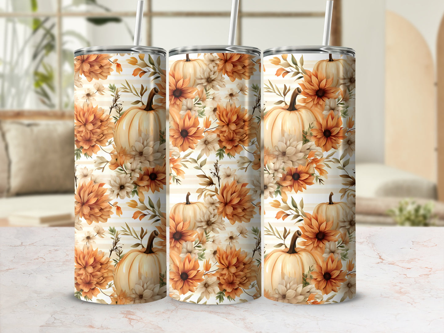 Three tumblers with a fall floral and pumpkin design.