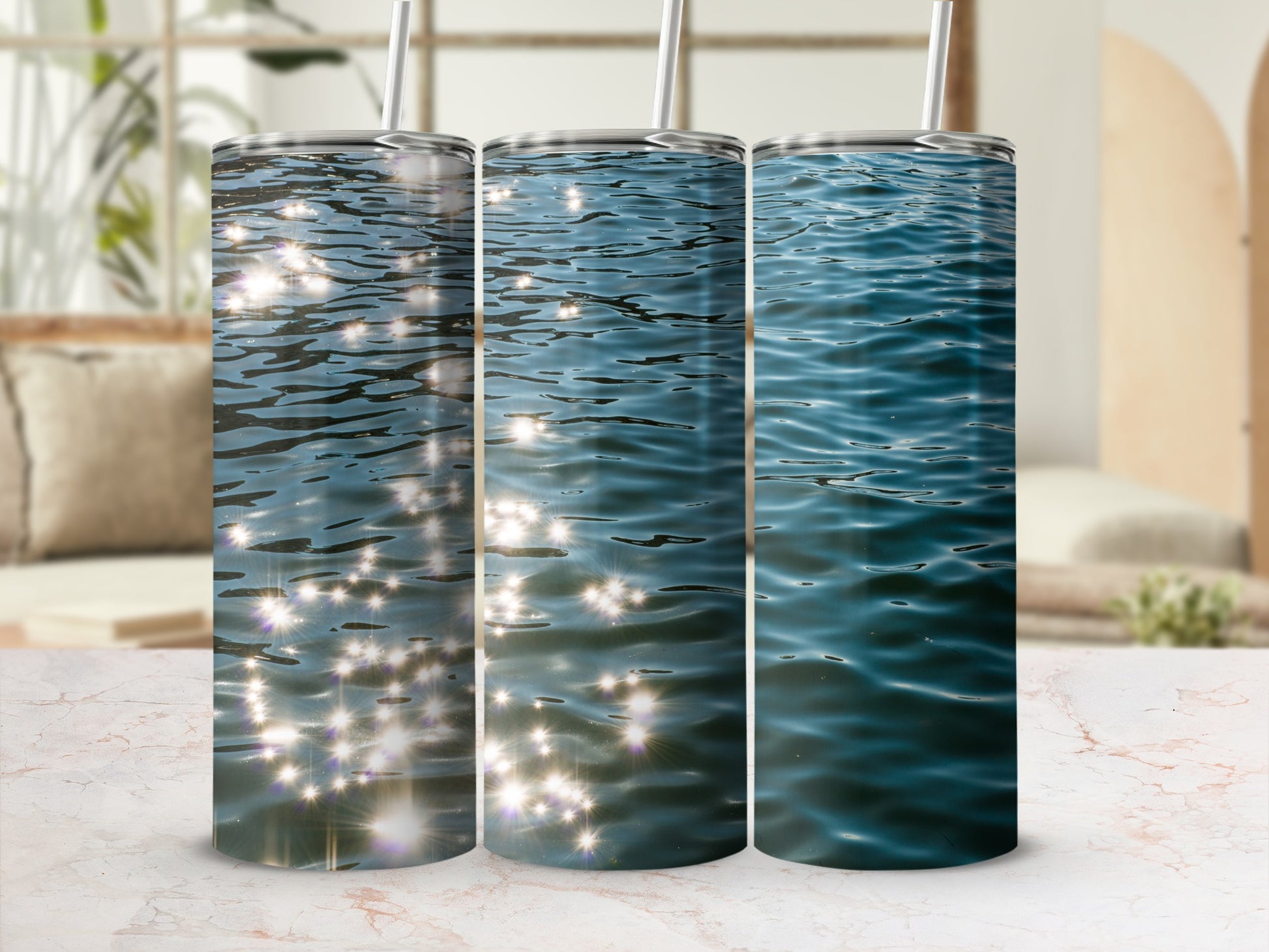Three tumblers showcasing sunlight reflecting on water.