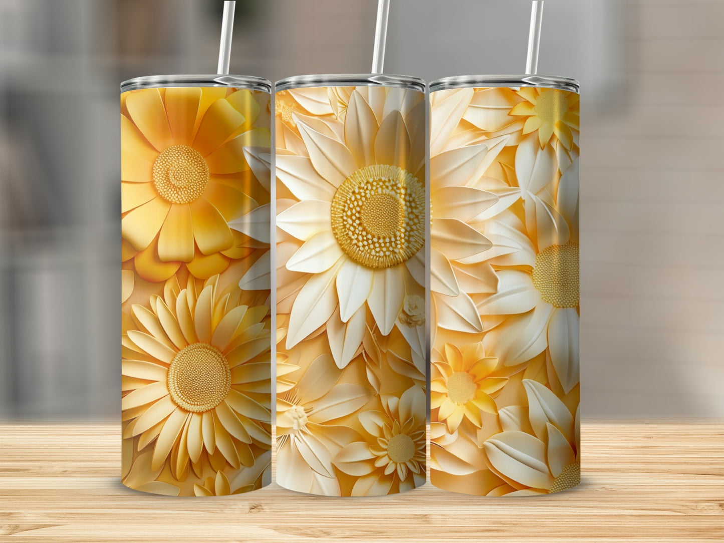 Three tall, cylindrical tumblers featuring a floral pattern in shades of yellow and white.