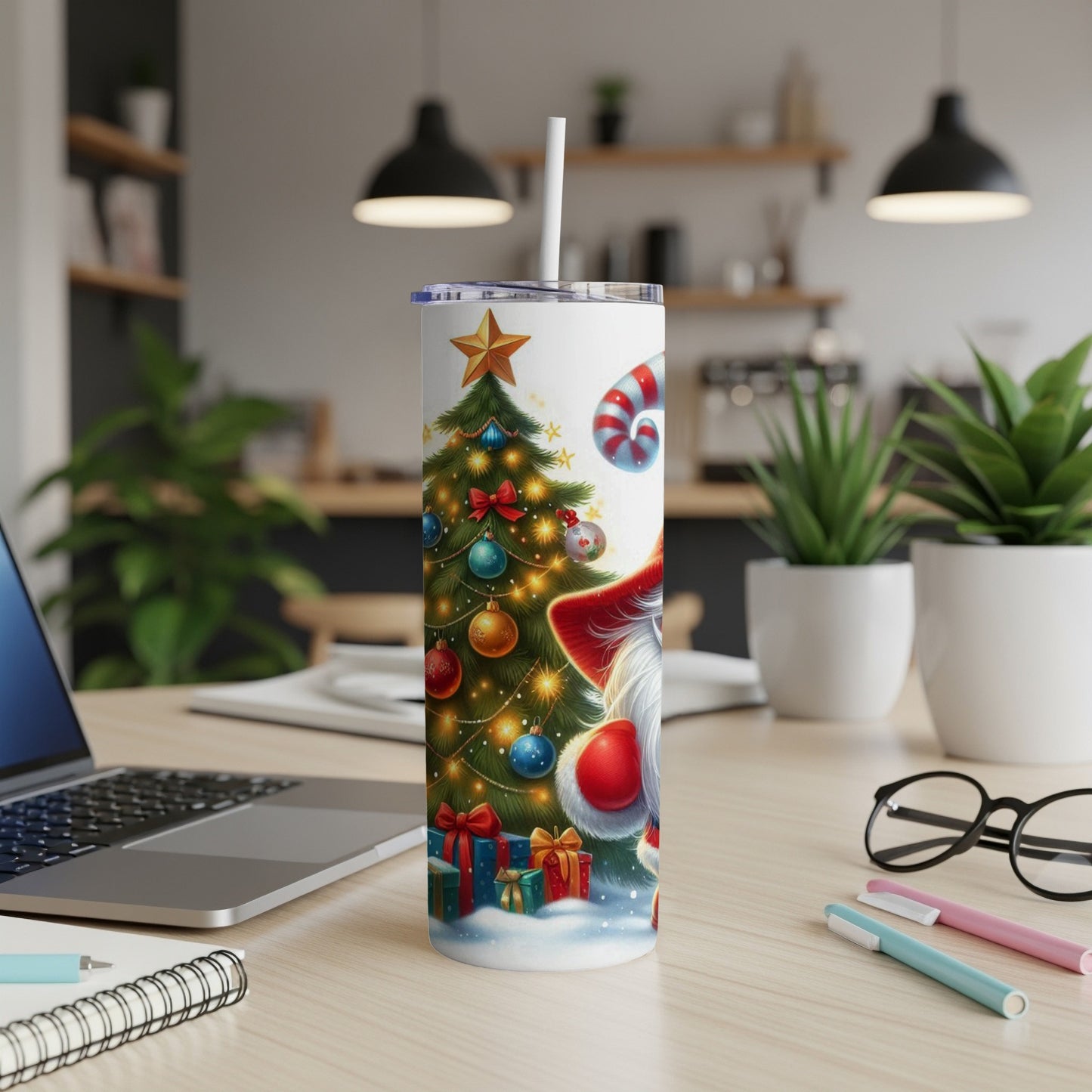 Santa and a Christmas tree on a white tumbler with a straw.