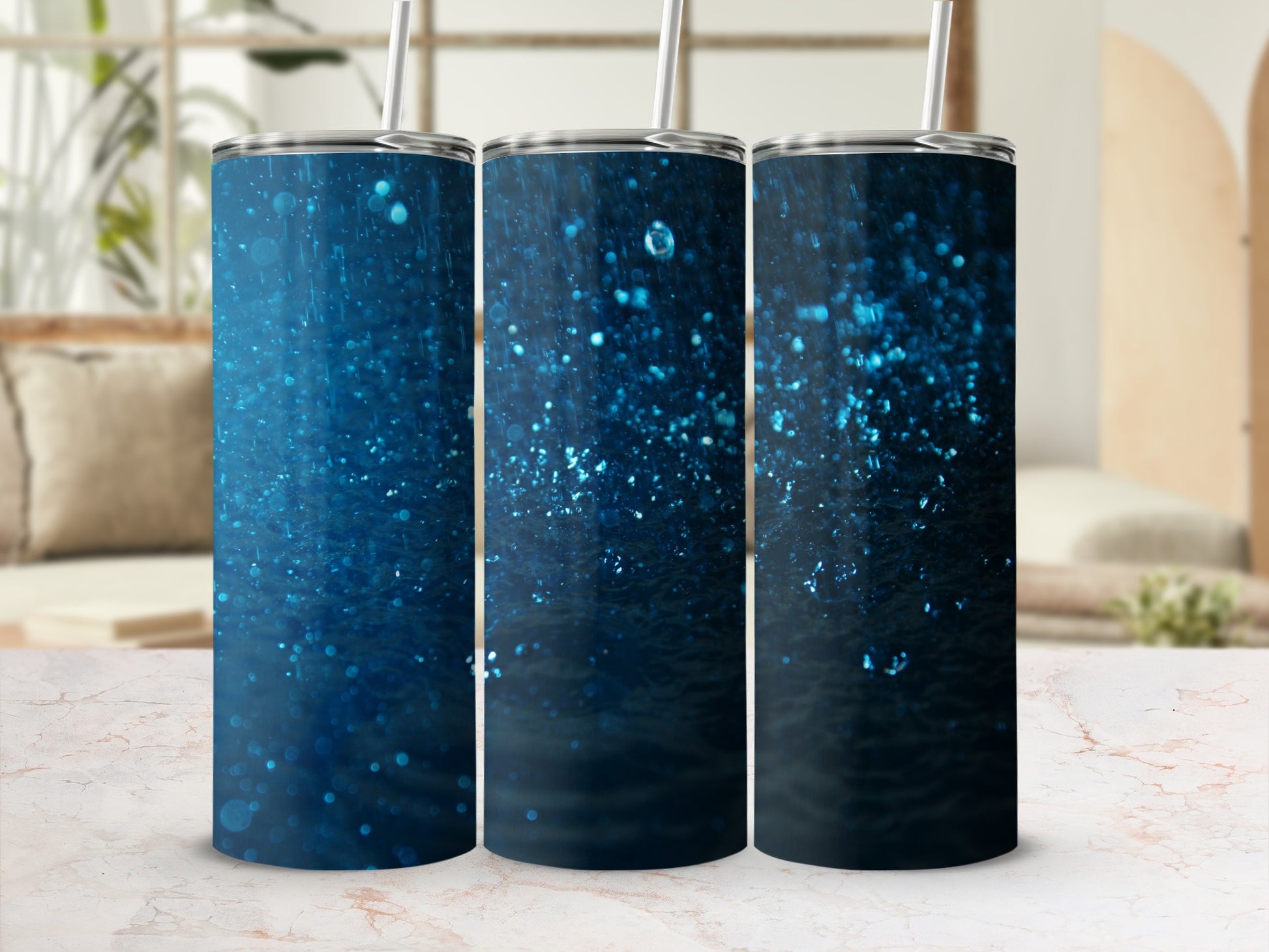 Three blue glitter tumblers with straws, displayed side-by-side.