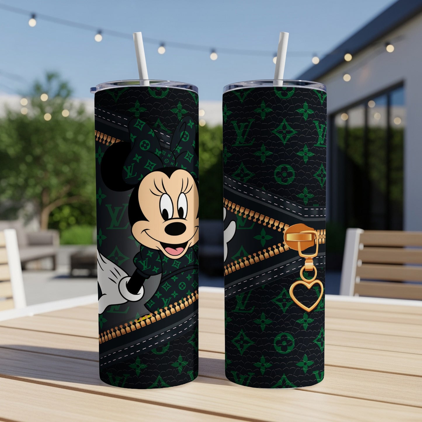 Minnie Mouse on black patterned tumbler with gold zipper detail.