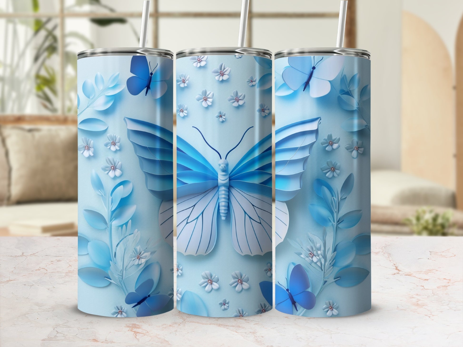 Light blue tumbler with large butterfly and floral design.