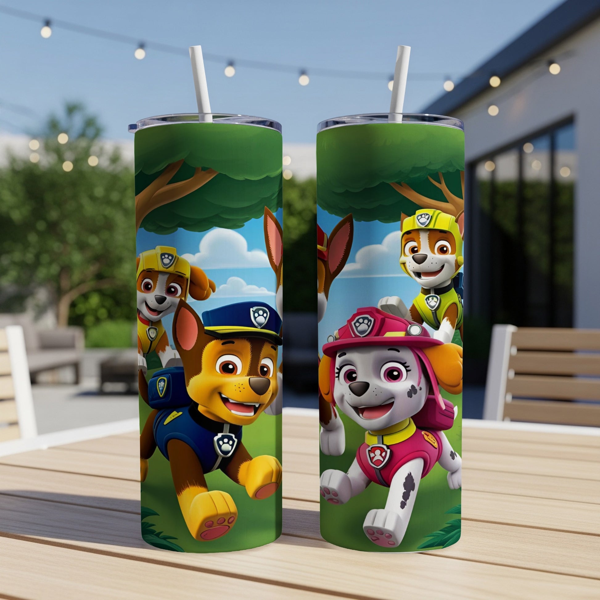 Two Paw Patrol tumblers with Chase and Skye on a picnic table outdoors.