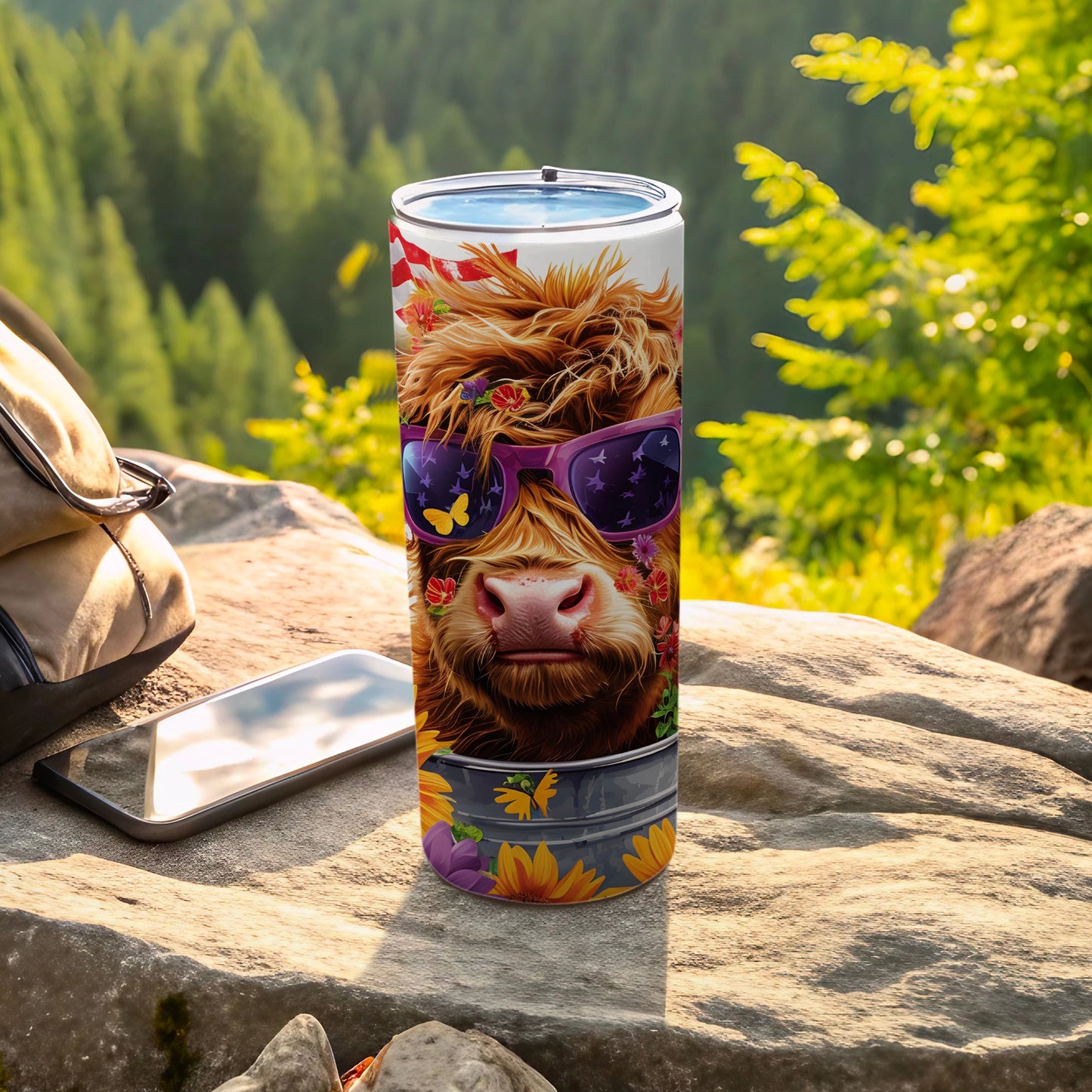 Highland cow wearing sunglasses on a tumbler with floral design.