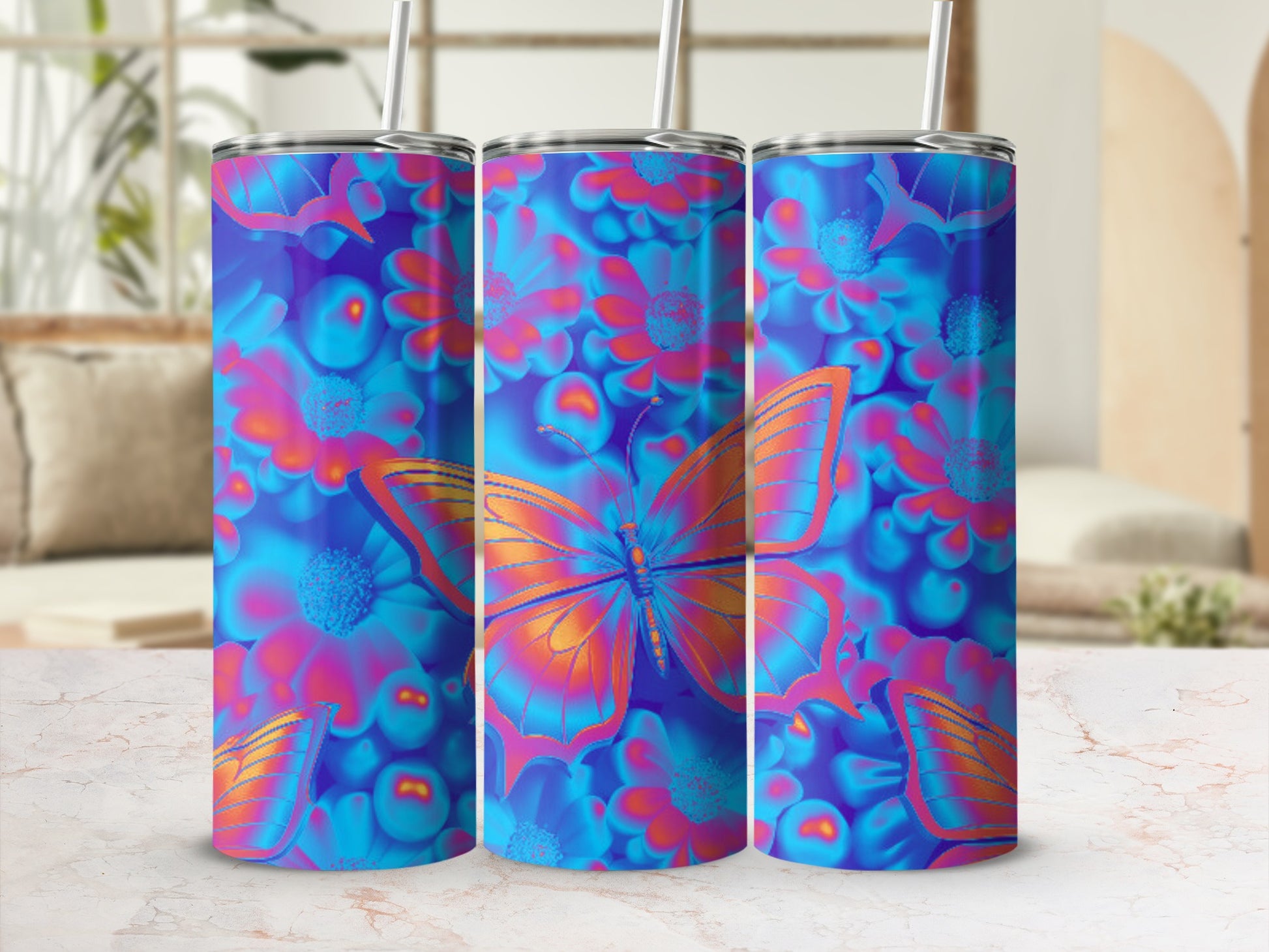 Three tumblers with a vibrant blue floral and orange butterfly design.