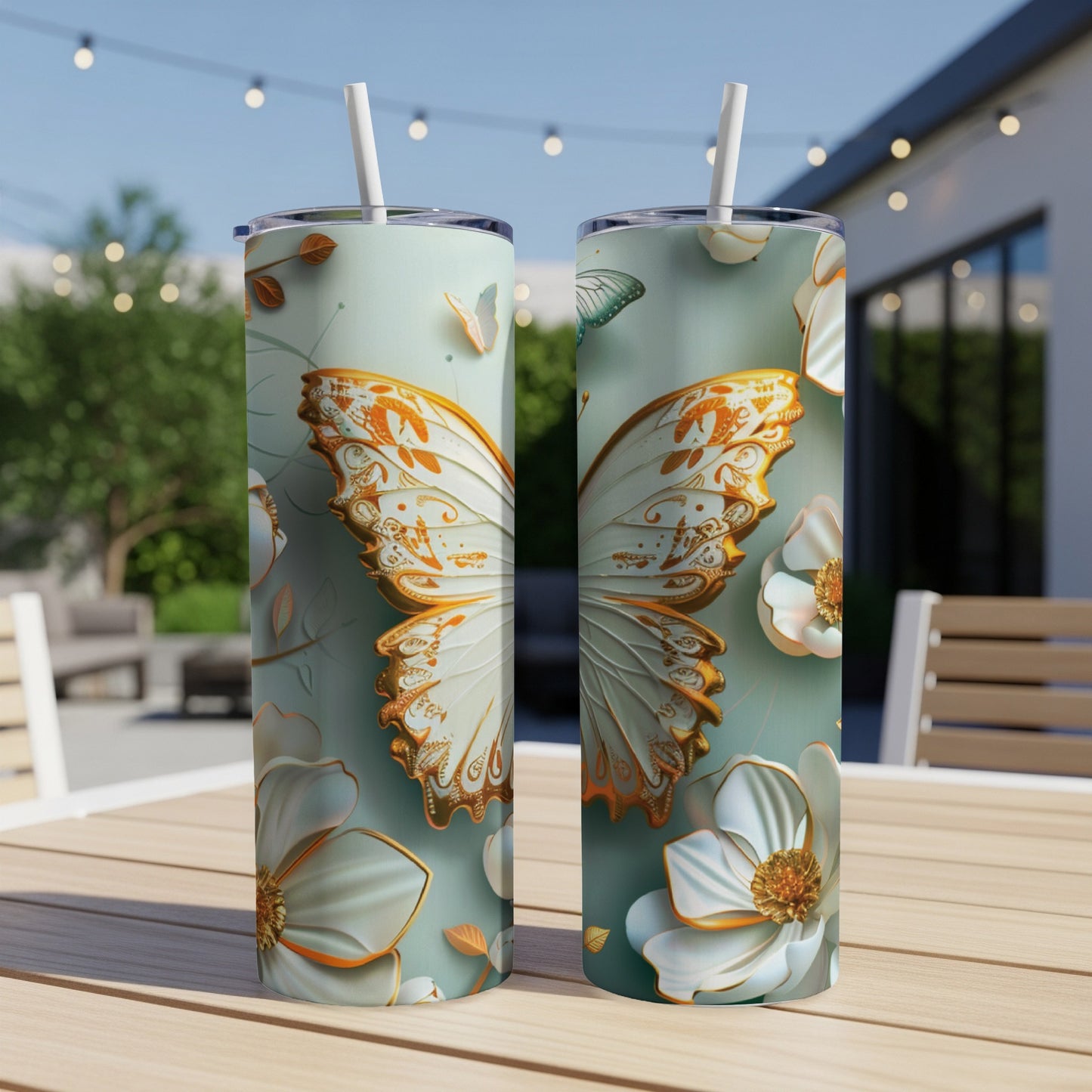 Two tumblers featuring ornate white and gold butterflies and floral designs.