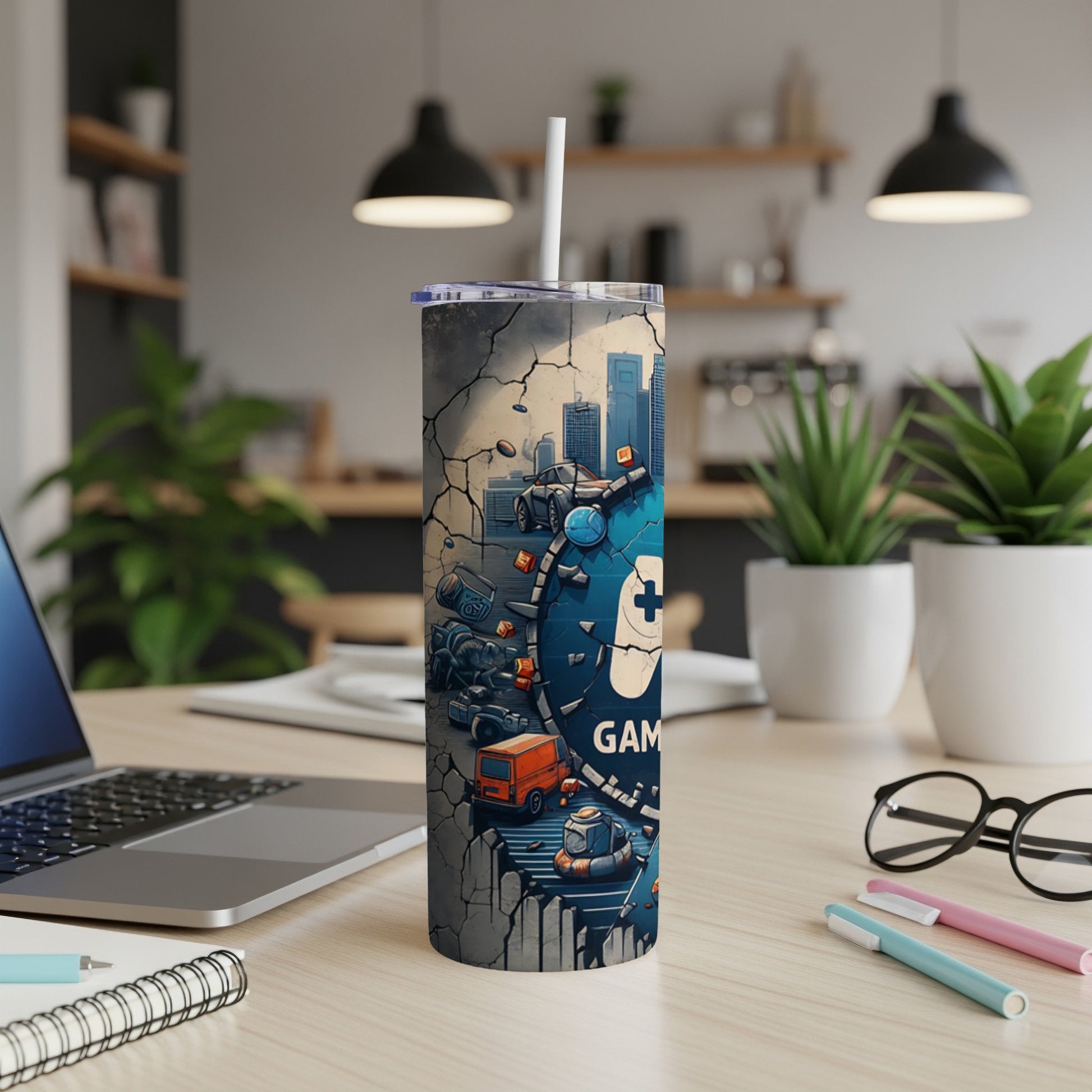 Tumbler with cracked pavement graphic featuring video game controller and cityscape.