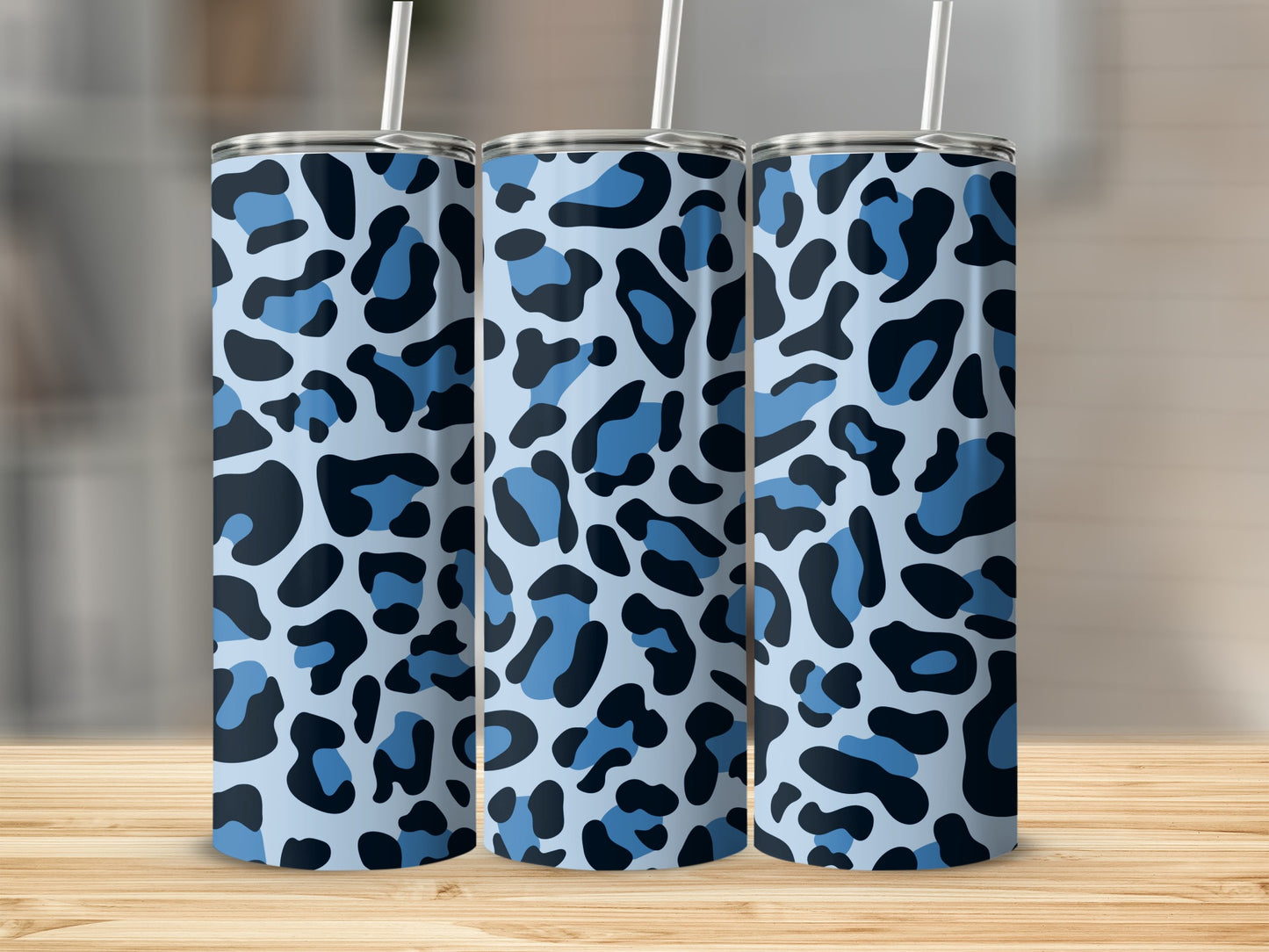 Three tumblers with light blue, dark blue, and black leopard print pattern.