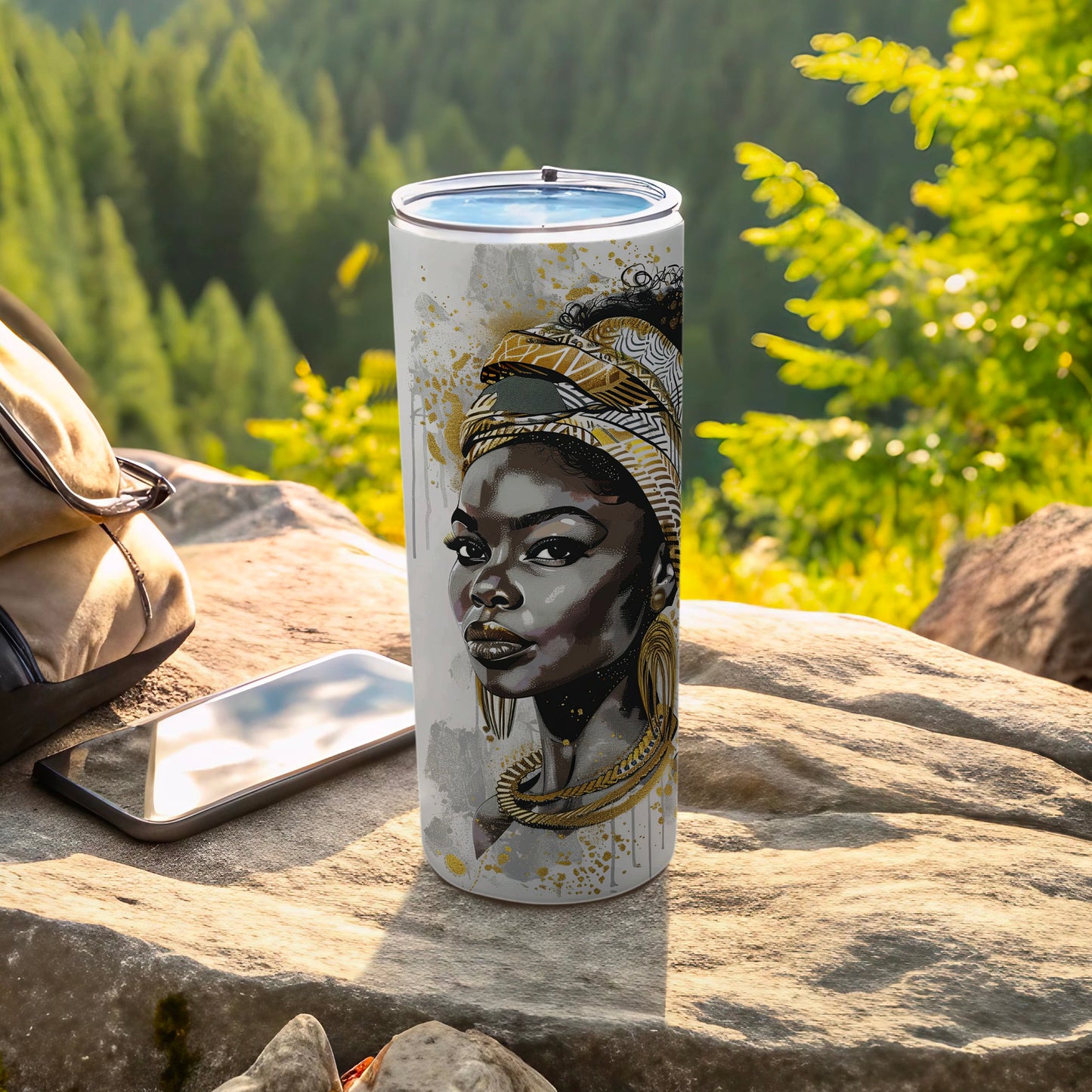 Tumbler with portrait of a Black woman wearing a headwrap and gold jewelry.