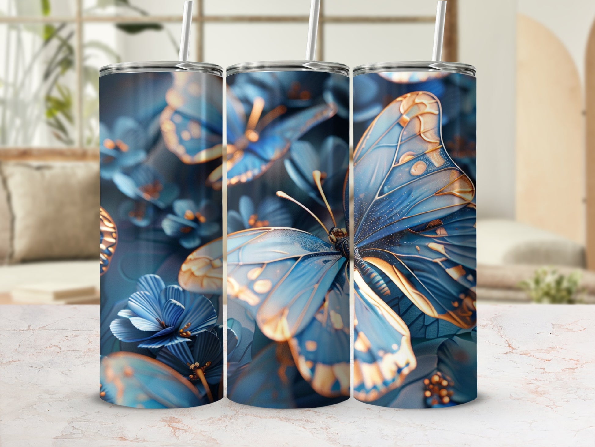 Blue and gold butterflies and flowers decorate a tall, slender tumbler.