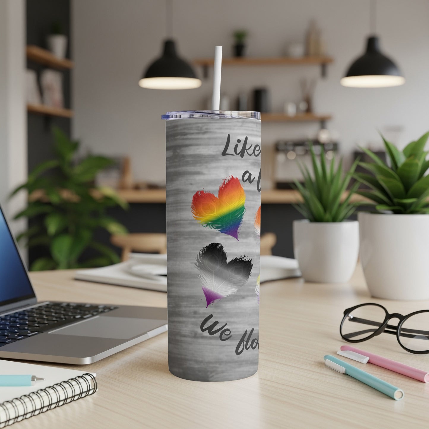 Tumbler with rainbow and pride heart graphics and text.