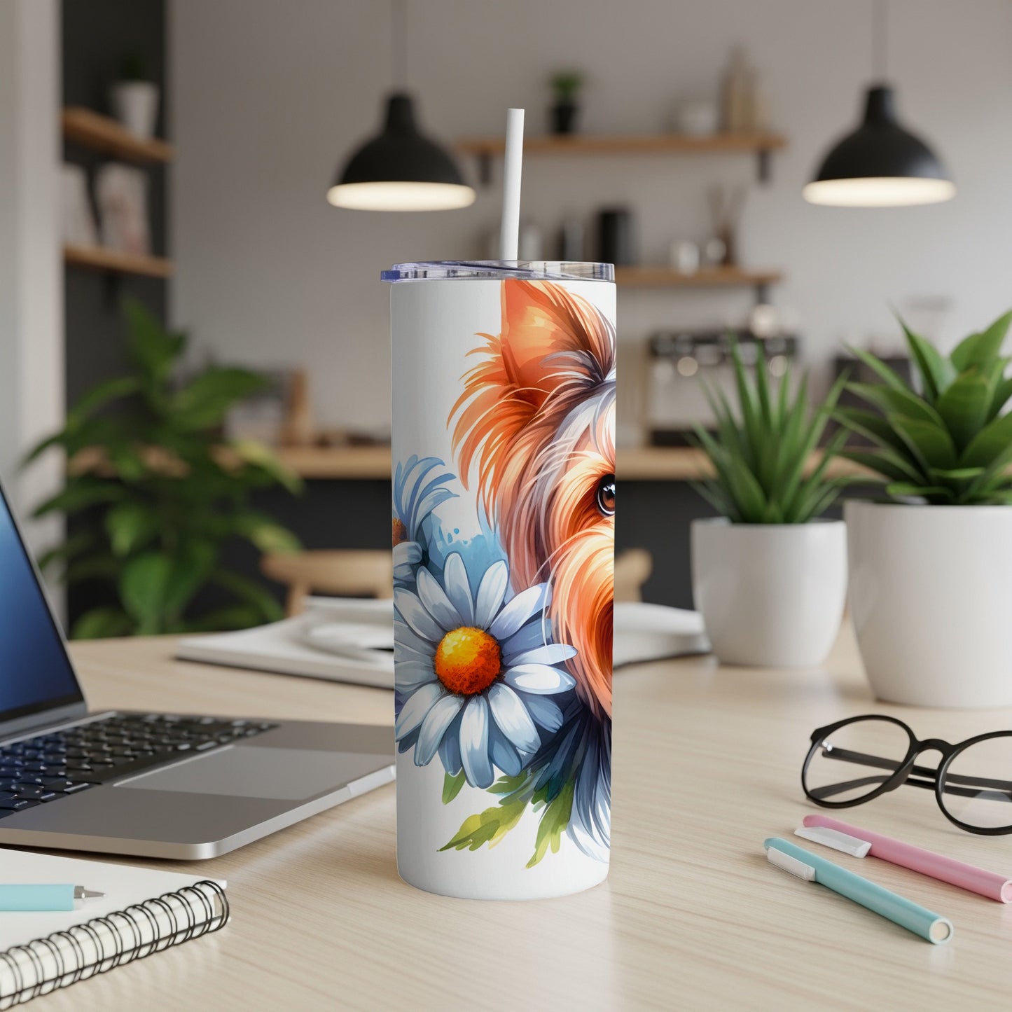 Yorkshire terrier face with blue and white flowers on a white tumbler.