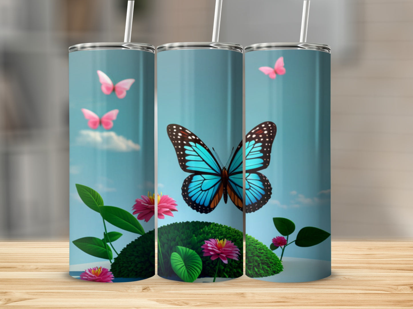 Three tumblers with blue butterfly and pink flowers design.