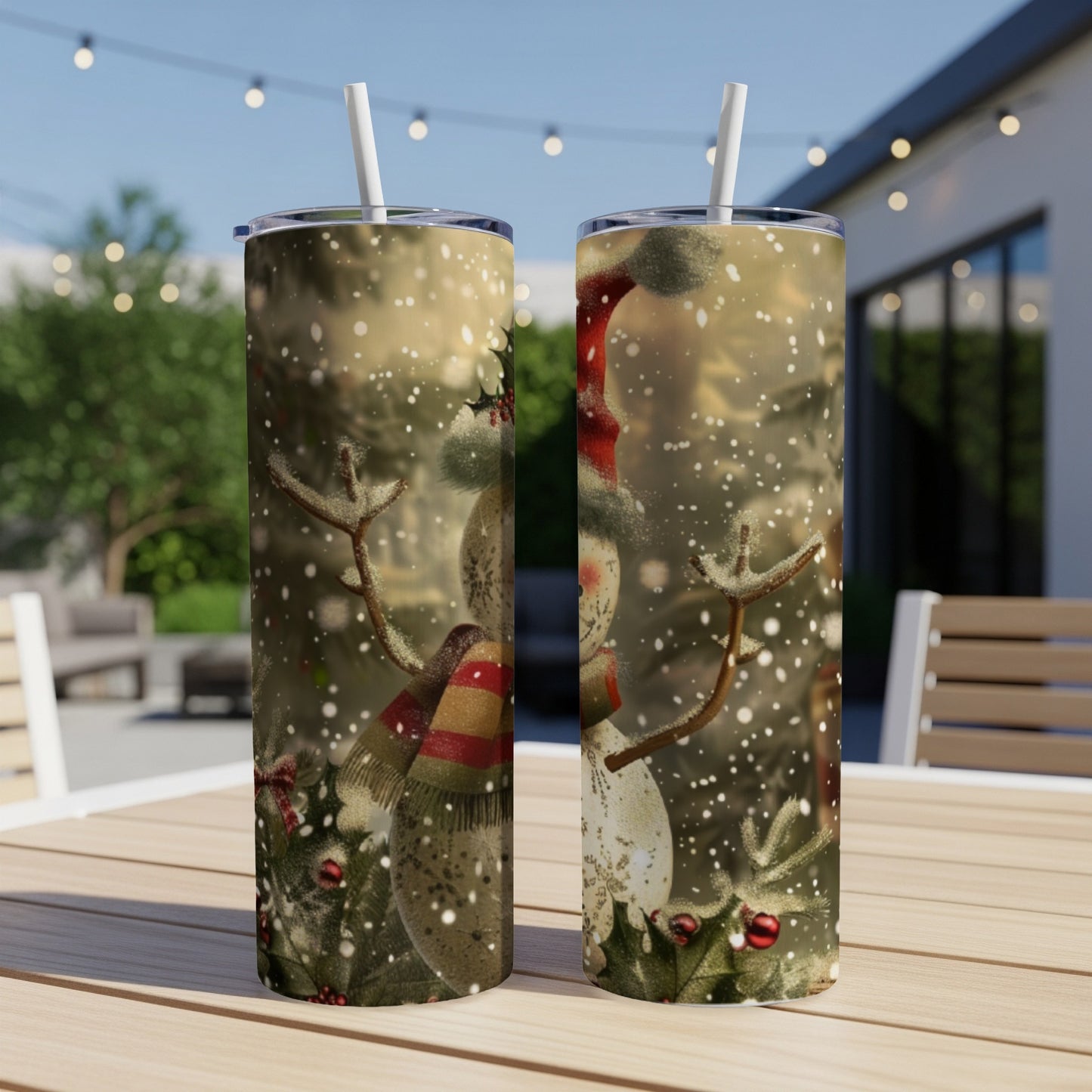 Two tumblers featuring a festive snowman design with falling snow.