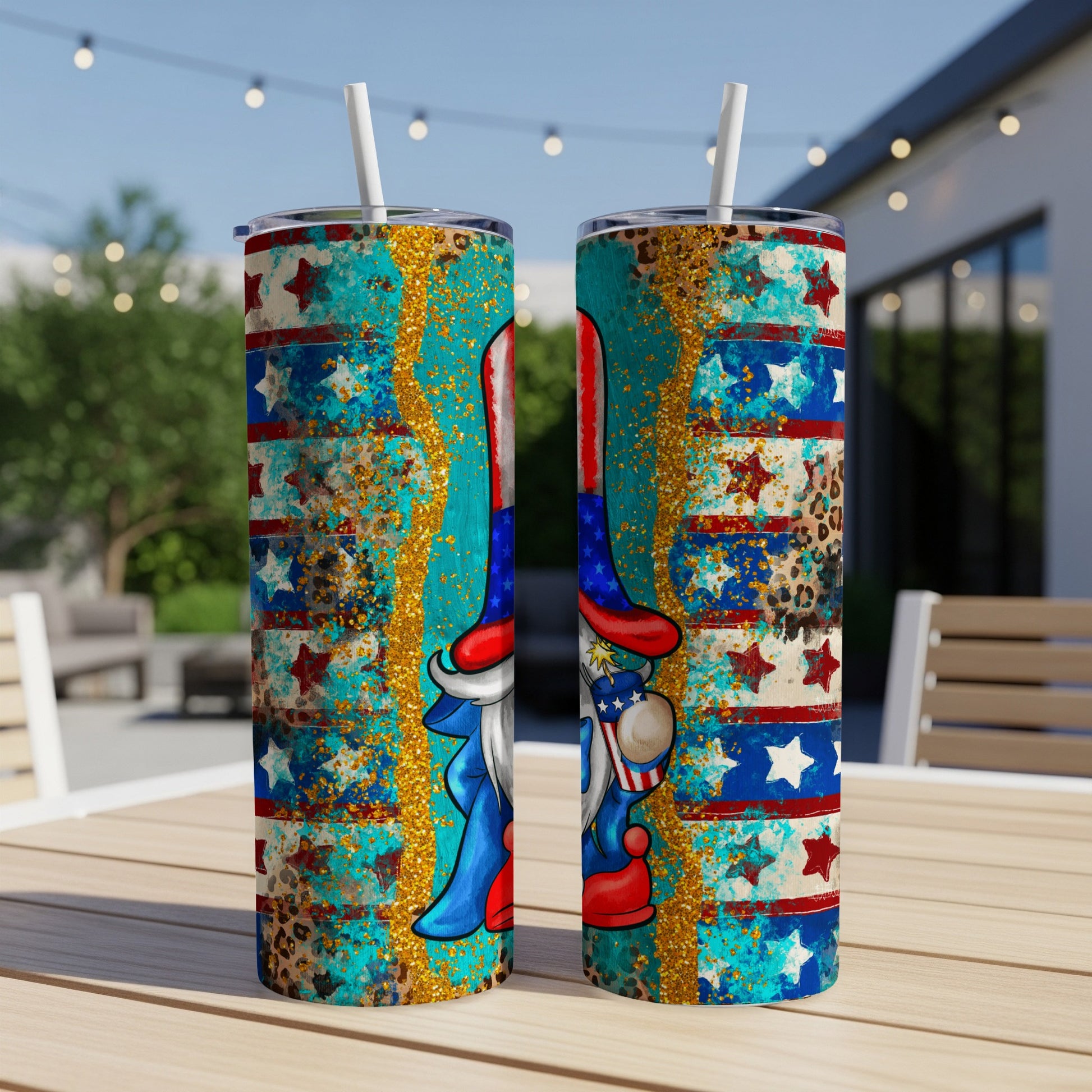 Two tumblers with patriotic gnome and stars design on outdoor table.