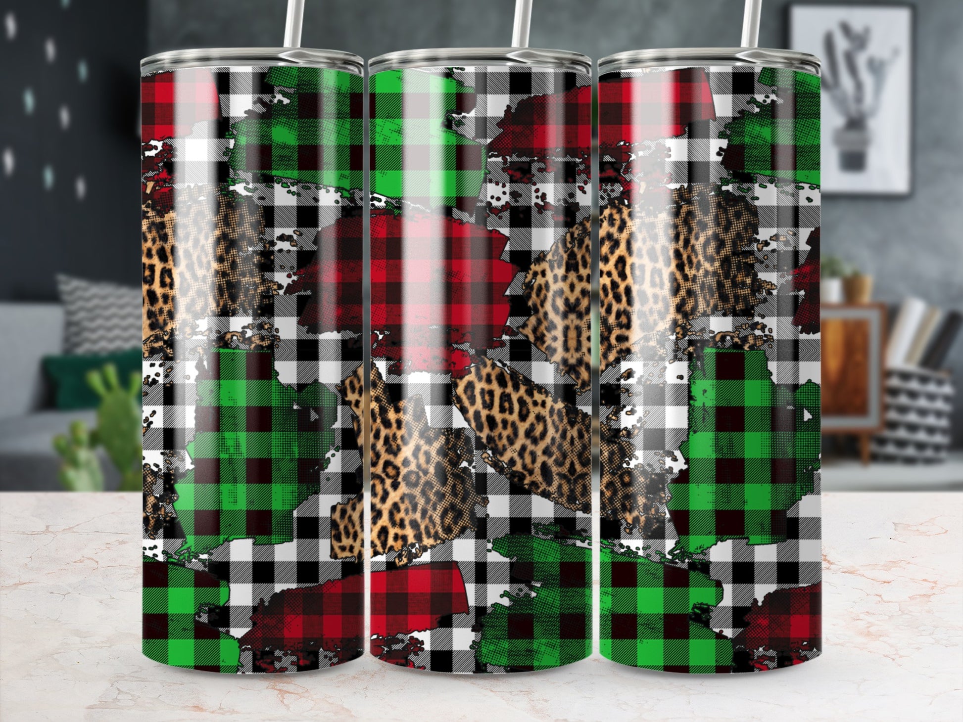Three tumblers with plaid and leopard print designs.