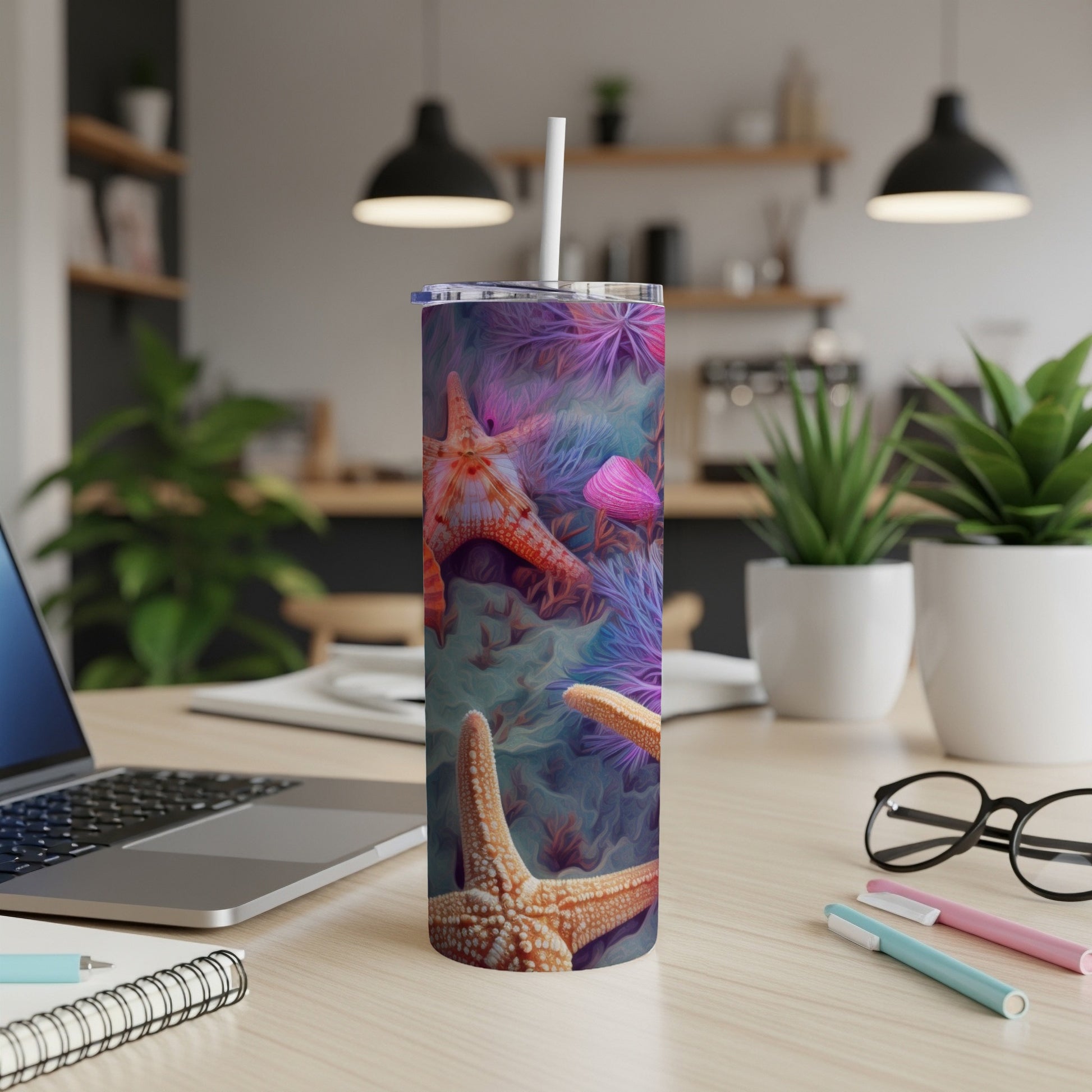 Tumbler with starfish, seashells, and coral reef pattern.