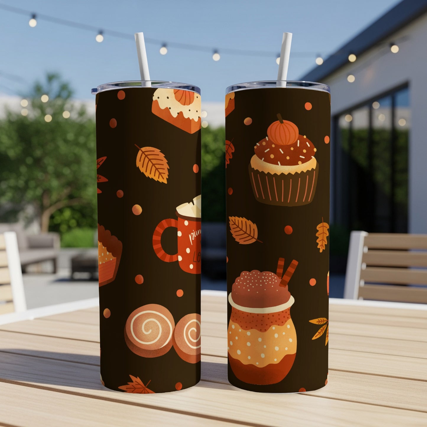 Two tumblers with fall-themed designs of cupcakes, cookies, and drinks.