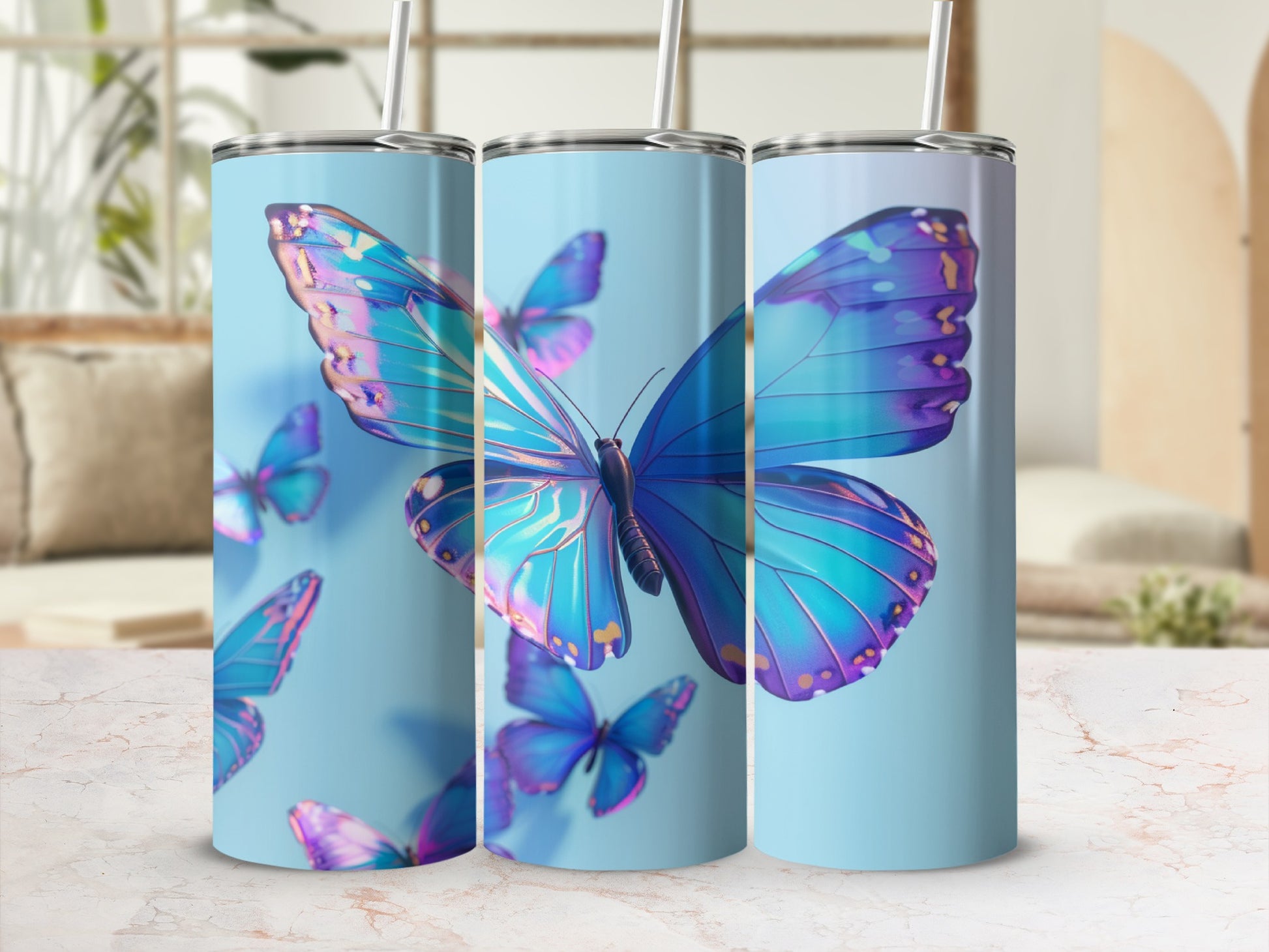 Three tall, skinny tumblers with iridescent blue butterflies against a light blue background.