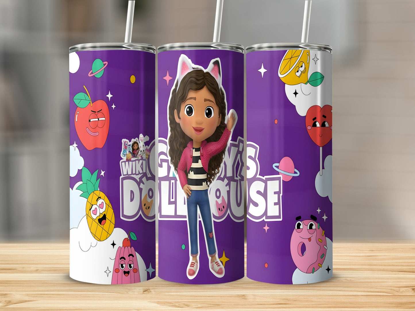Gabby's Dollhouse tumbler with Gabby, pineapple, apple, and planet designs.