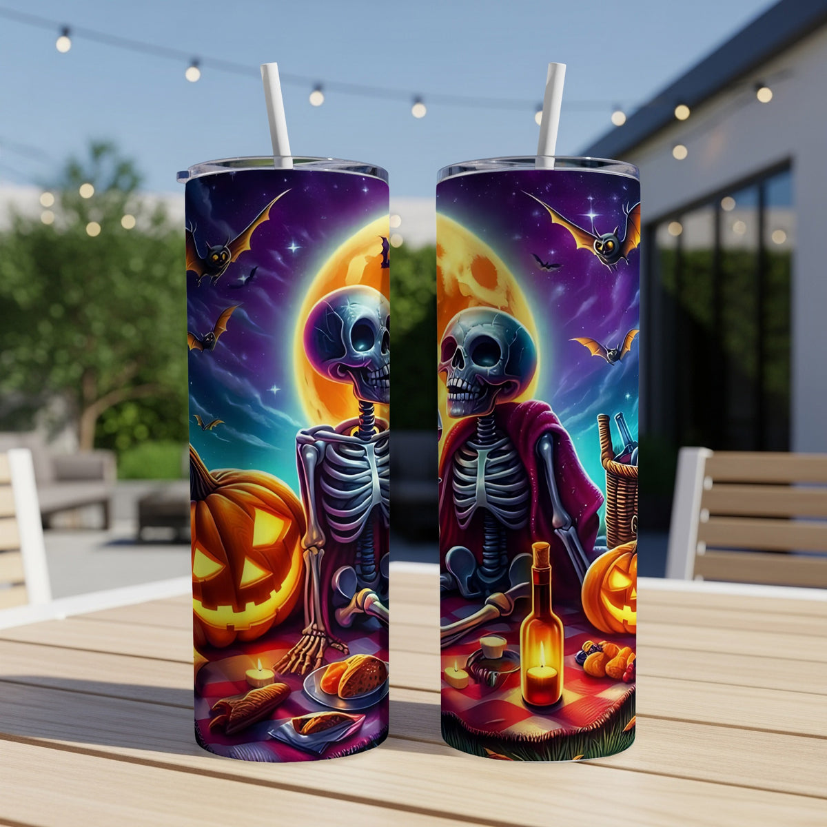 Halloween tumblers with skeletons, pumpkins, bats, and a full moon.