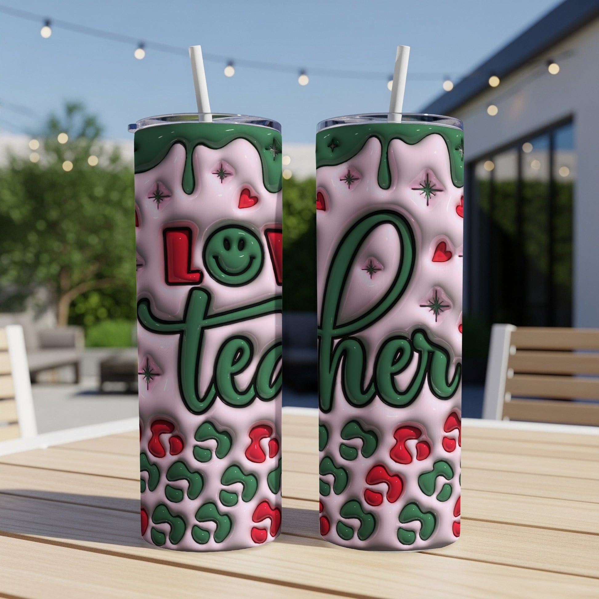 Two pink tumblers with green "Love Teacher" text and leopard print designs.