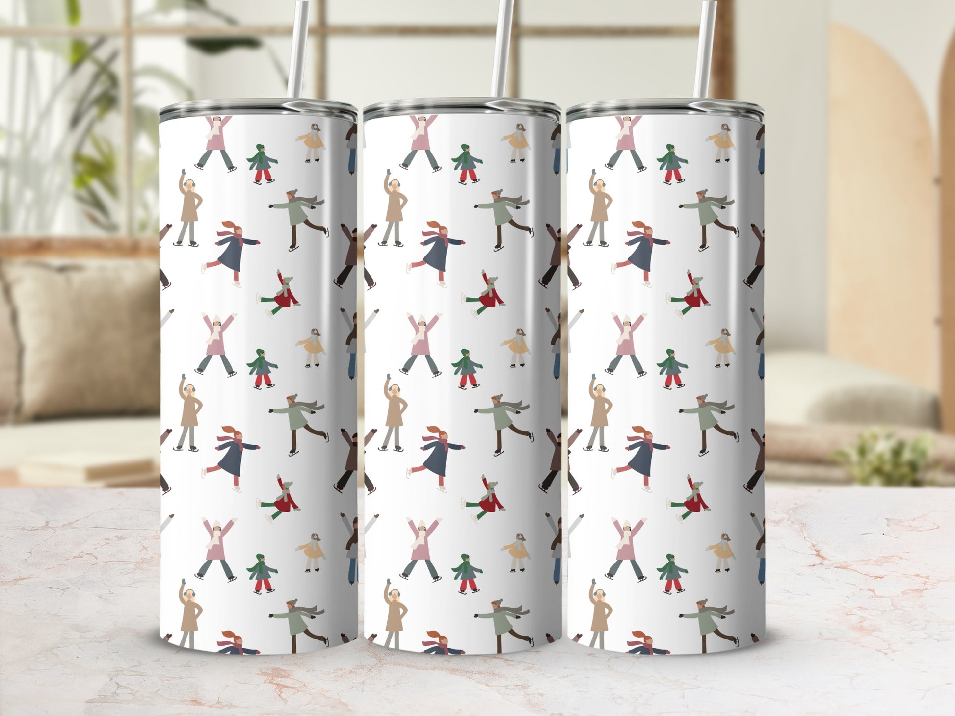 Tumbler with repeating pattern of ice skaters in colorful winter clothing.