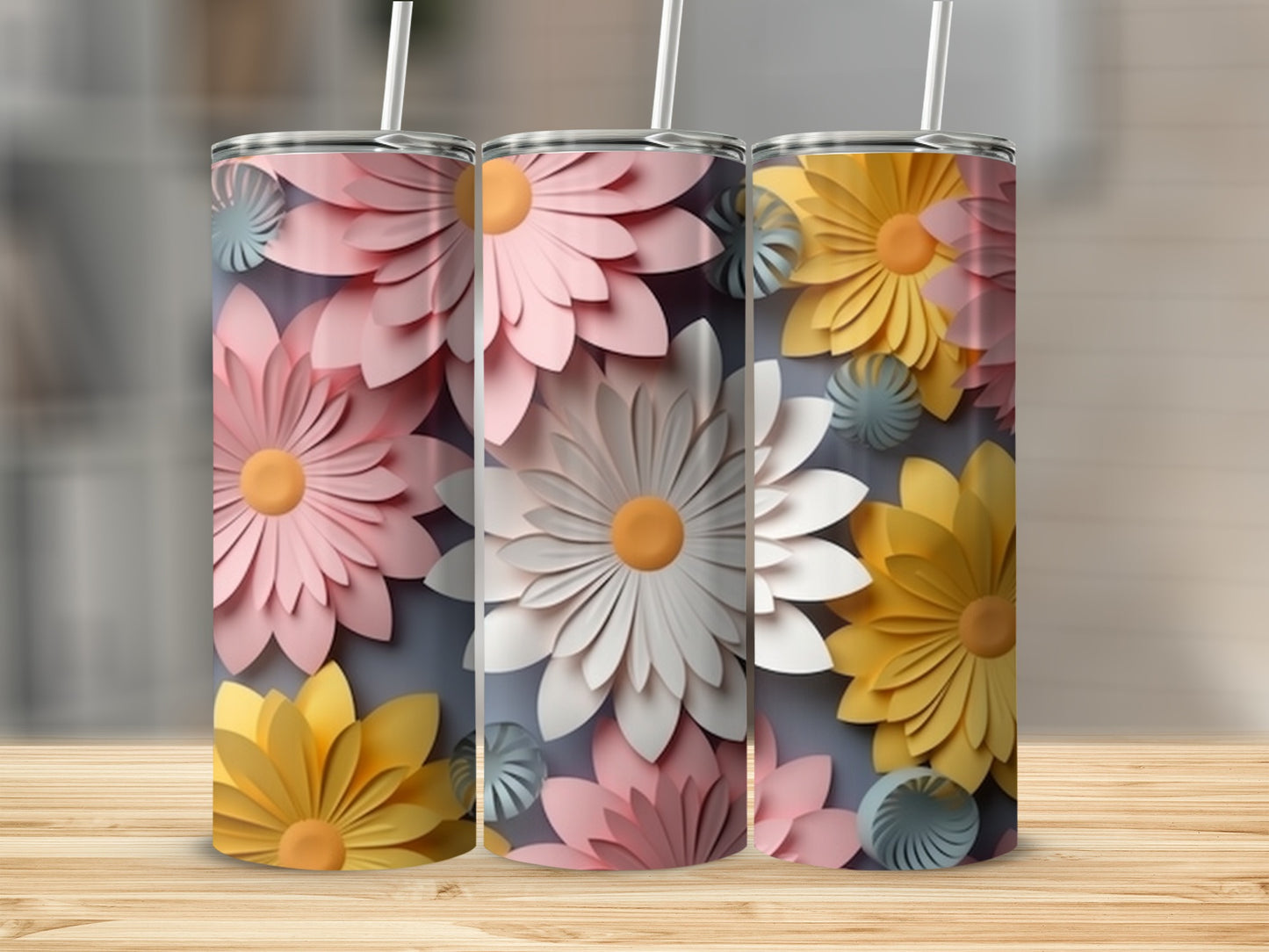 Three tumblers featuring large, layered floral designs in pink, white, and yellow.