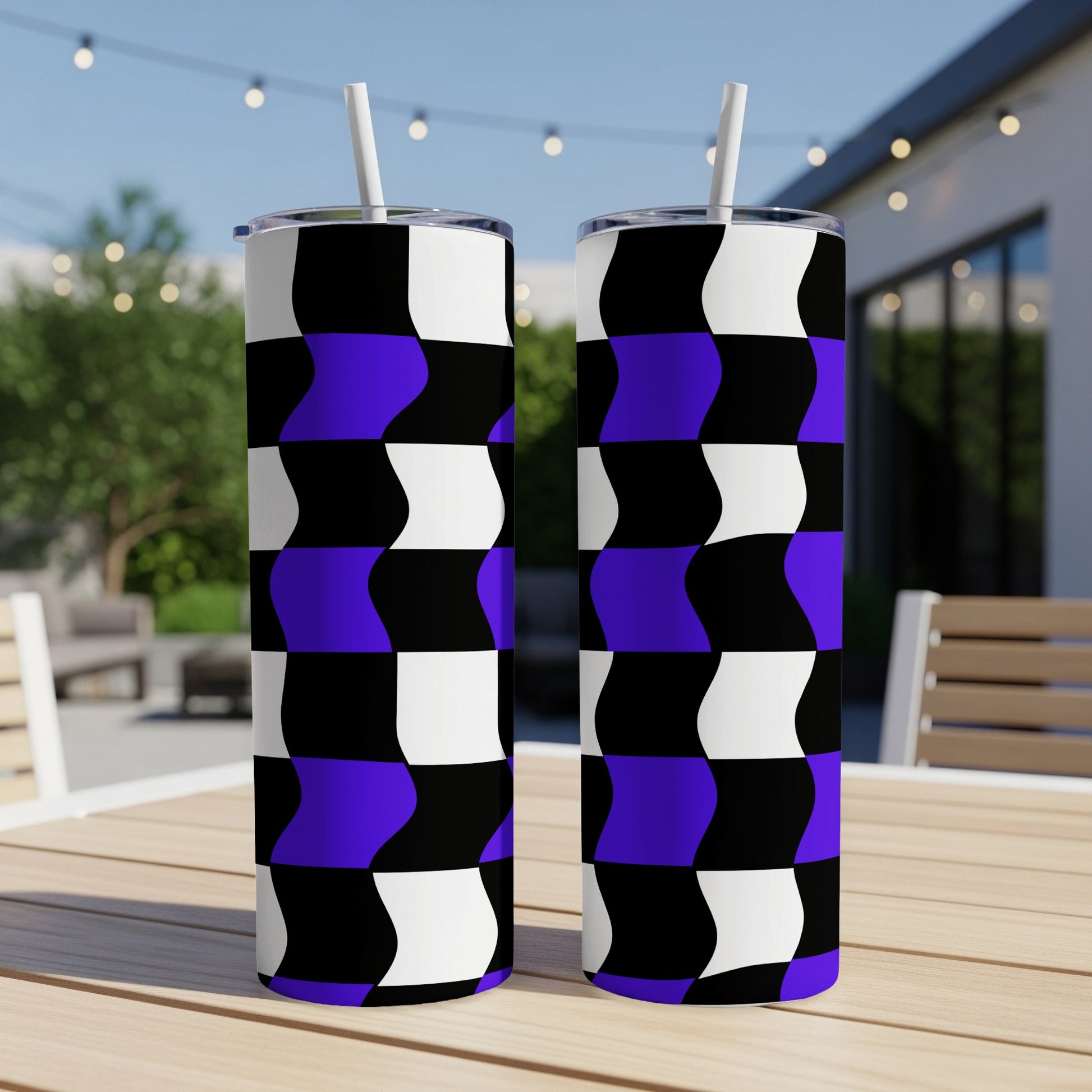 Two tall tumblers with a black, white, and purple checkered pattern.