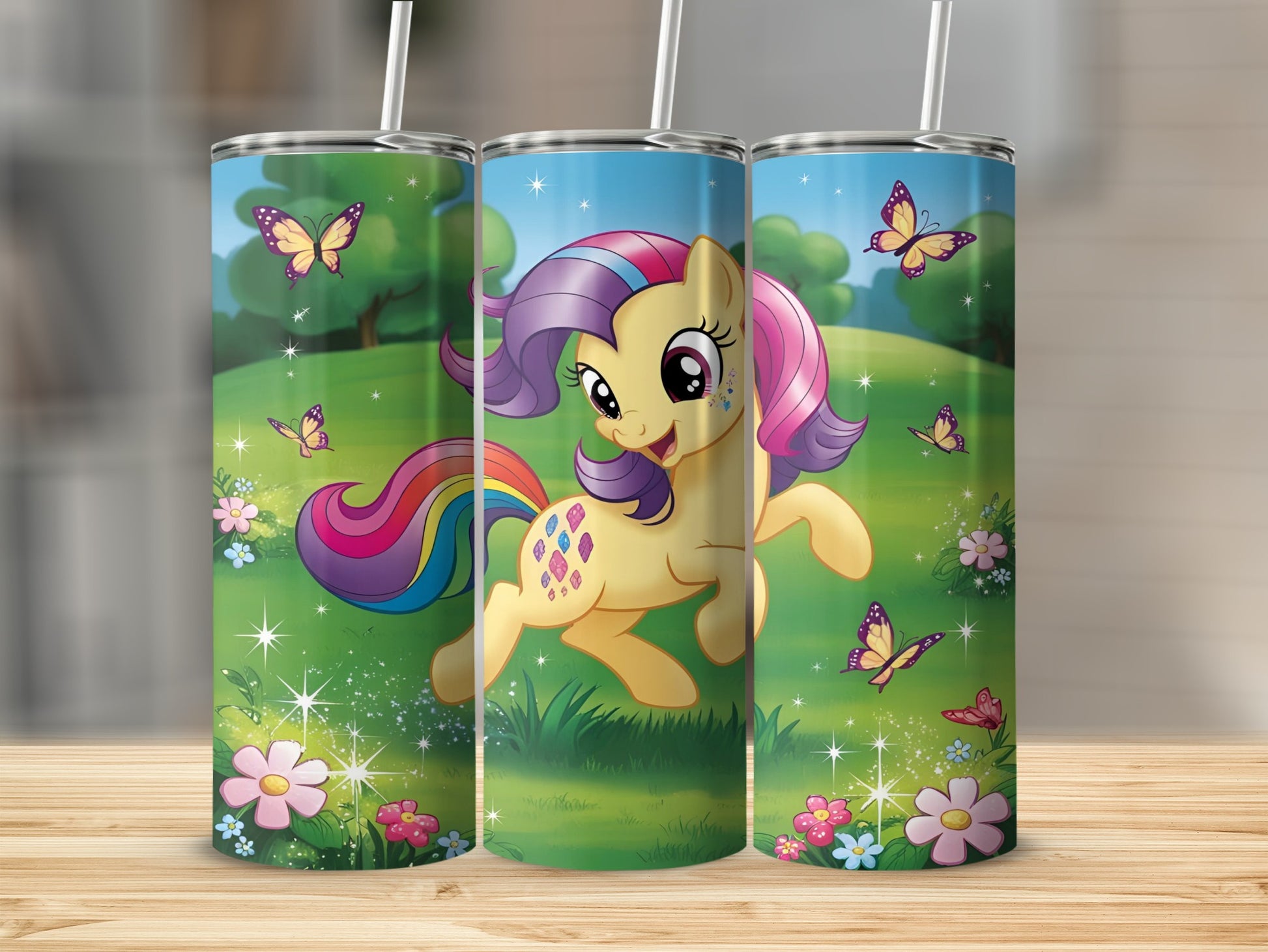 Yellow cartoon pony with rainbow mane and tail, surrounded by butterflies and flowers.