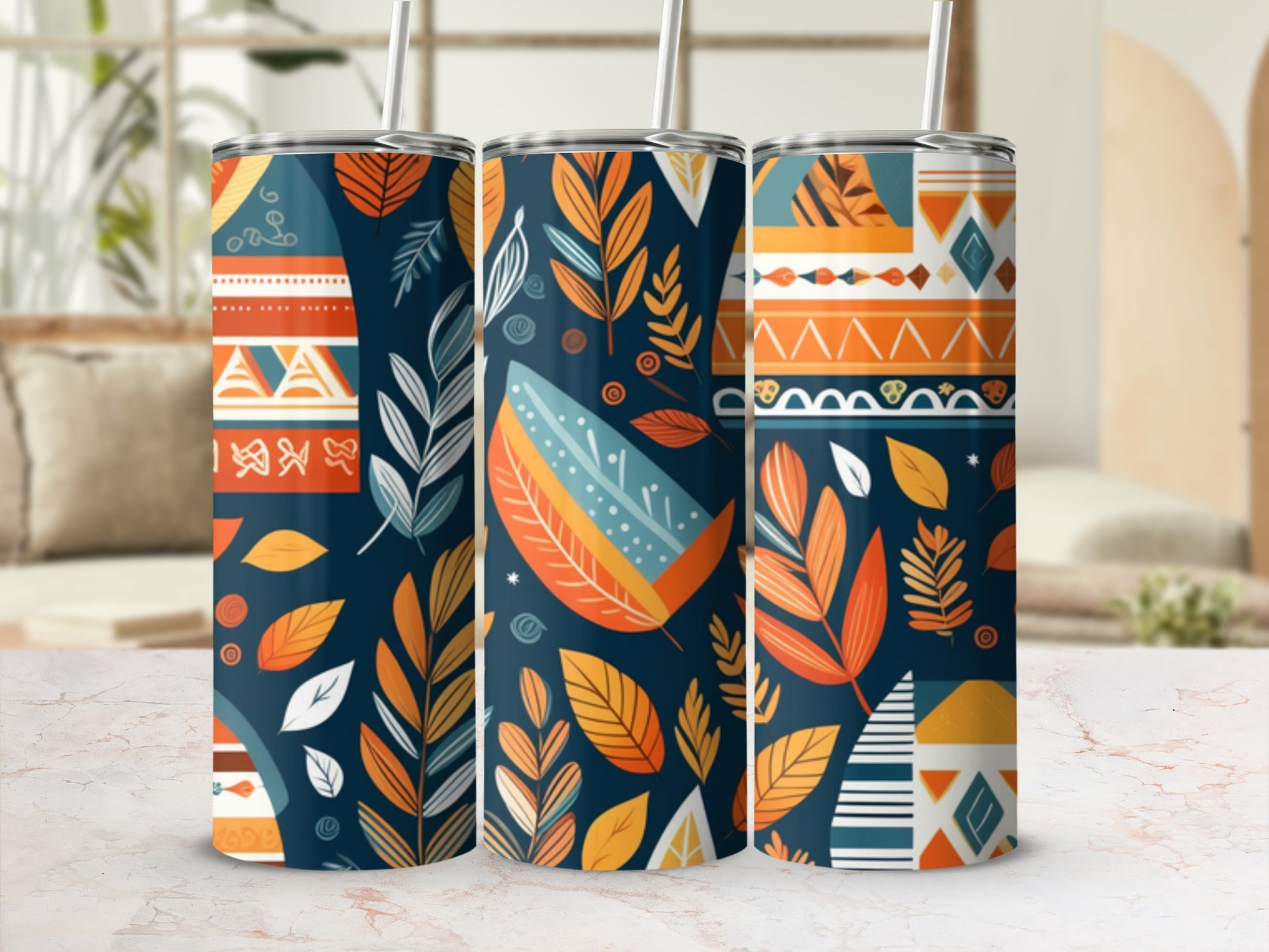 Three patterned tumblers with floral and geometric designs in warm autumn colors.