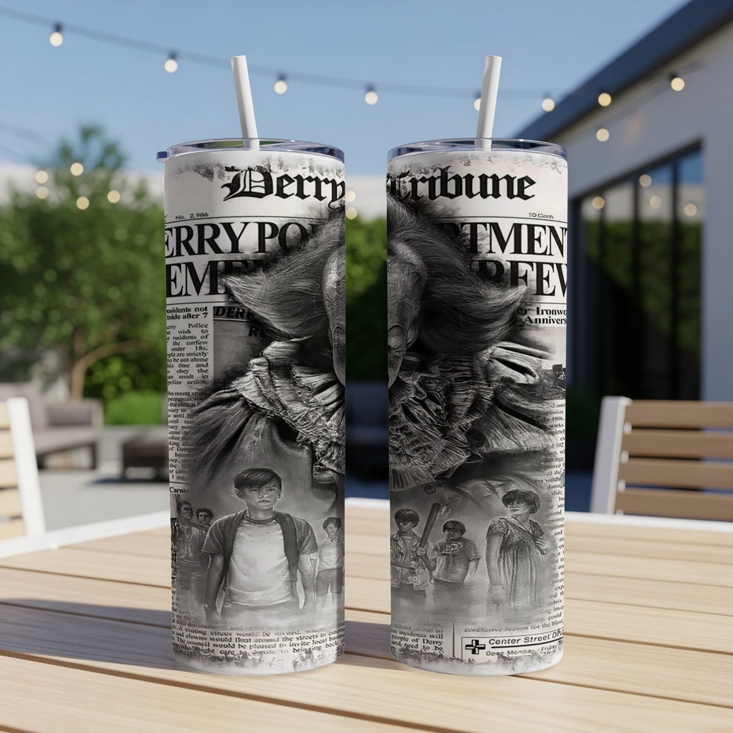 Two tumblers with a newspaper-style wrap featuring Pennywise and children from IT.