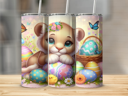 Lion cub with Easter eggs and butterflies on a tumbler.