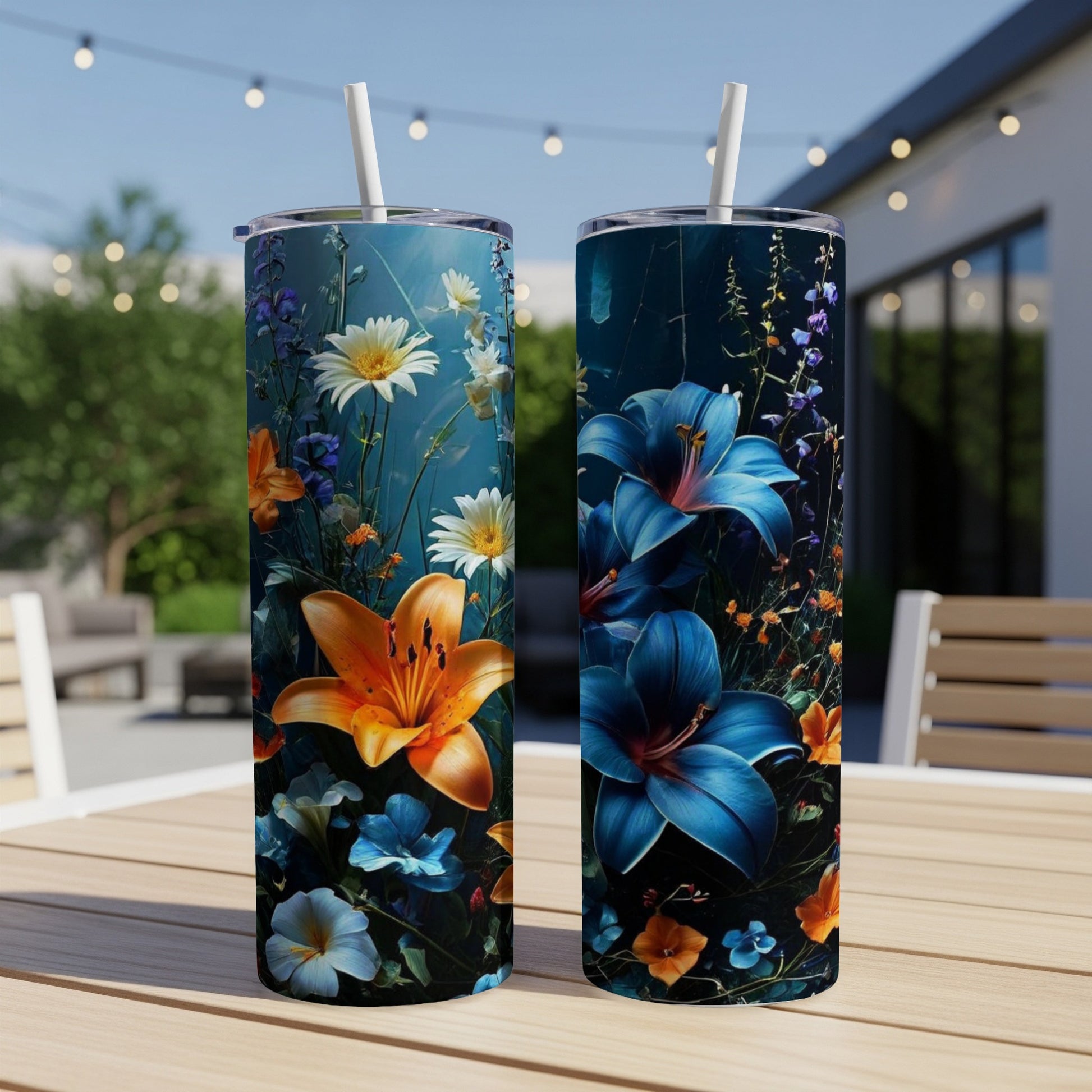 Two tumblers with vibrant floral designs, one orange lily, one blue lily.