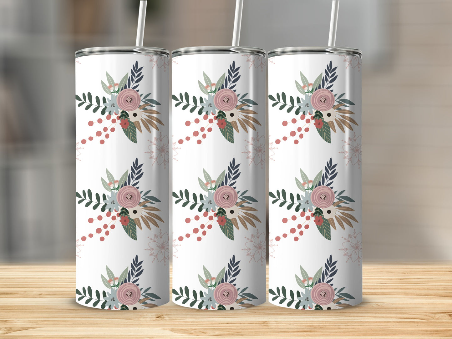 Three white tumblers with a floral and dot pattern on a wooden surface.
