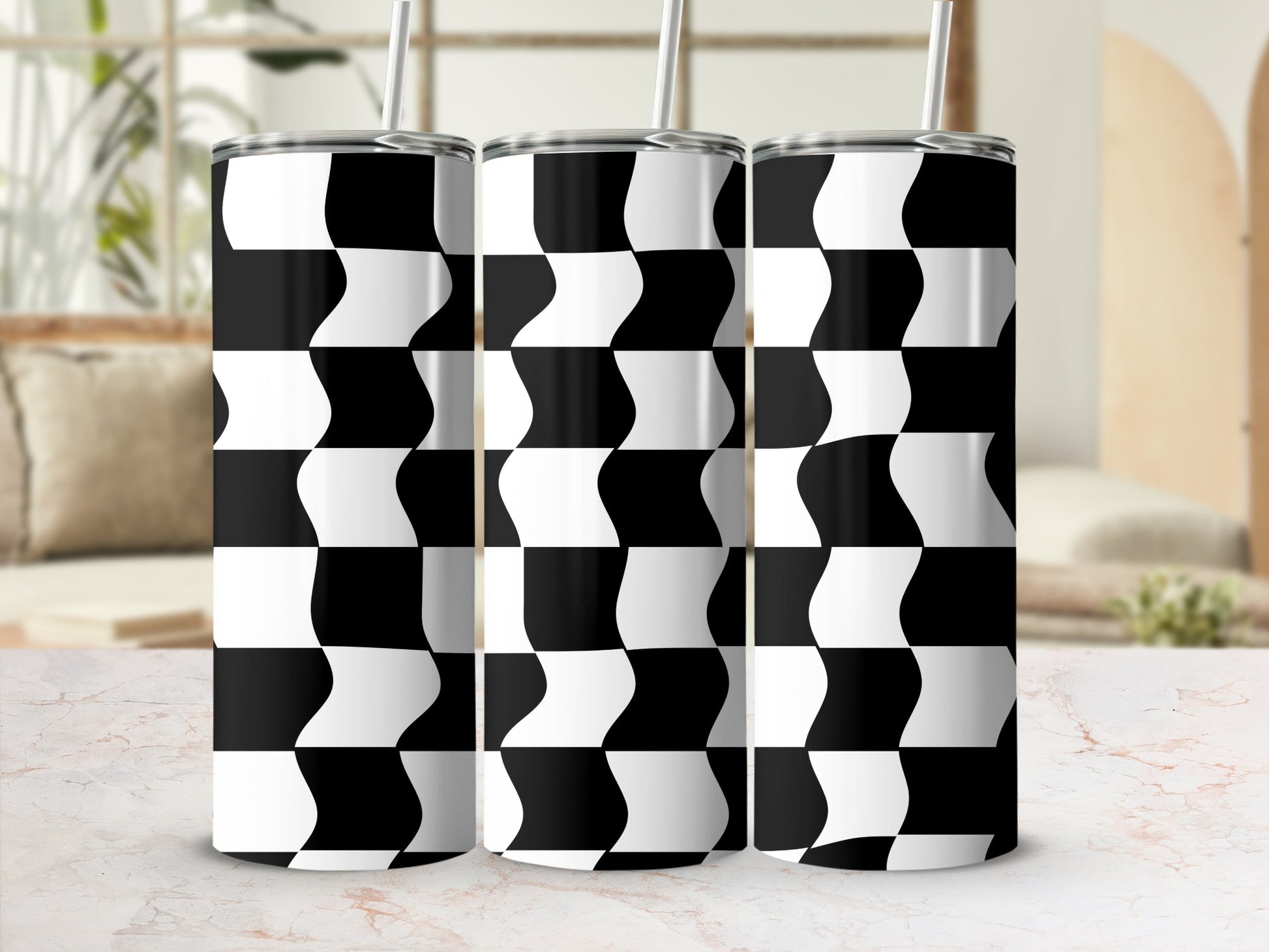 Black and white checkered wave pattern on three stainless steel tumblers.