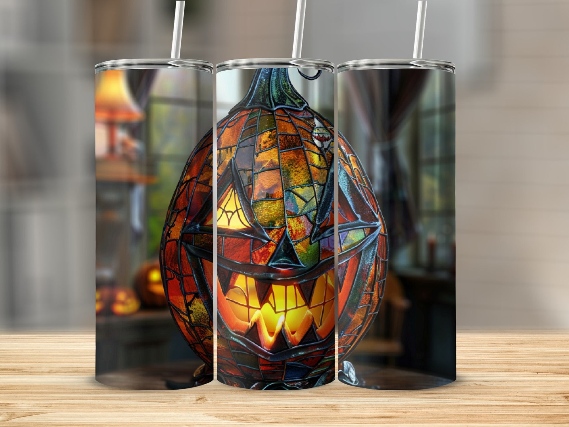 Stained glass jack-o'-lantern tumbler with straw on wooden surface.