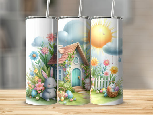 Easter scene with bunnies, colorful eggs, and a house on a tumbler.
