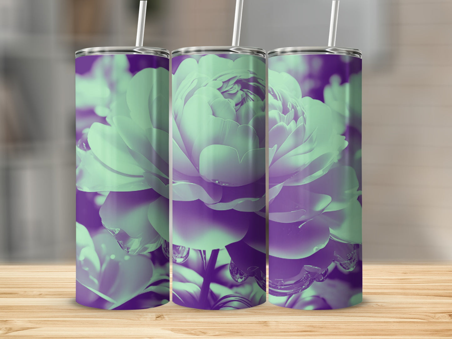 Three tumblers with a purple and green floral design on a wooden surface.